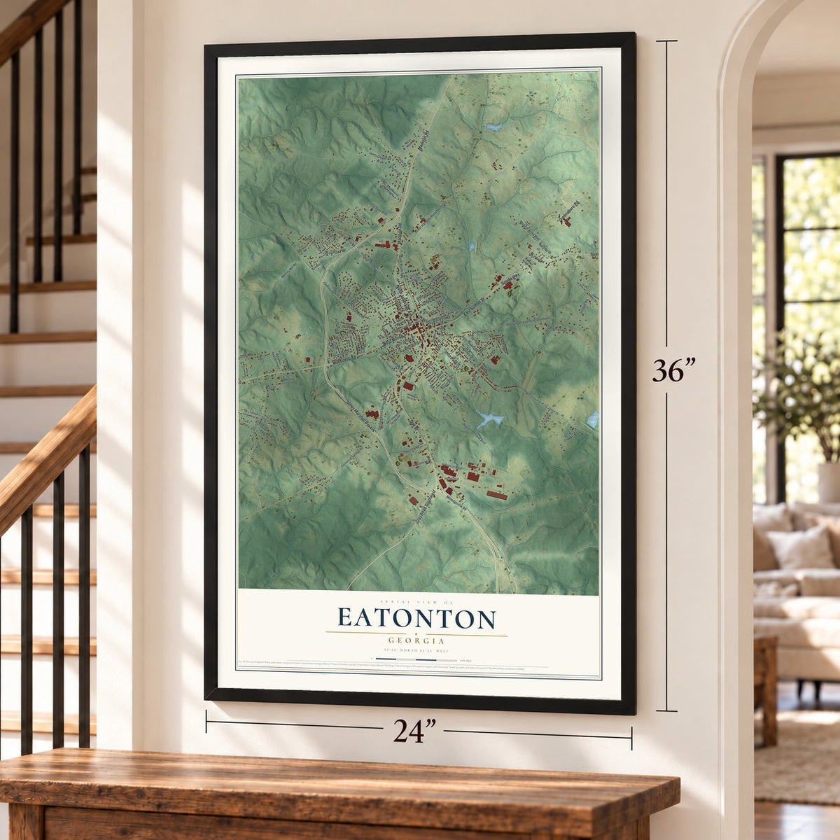 Eatonton, Georgia map, 24 x 36 inch print in a black frame by a staircase
