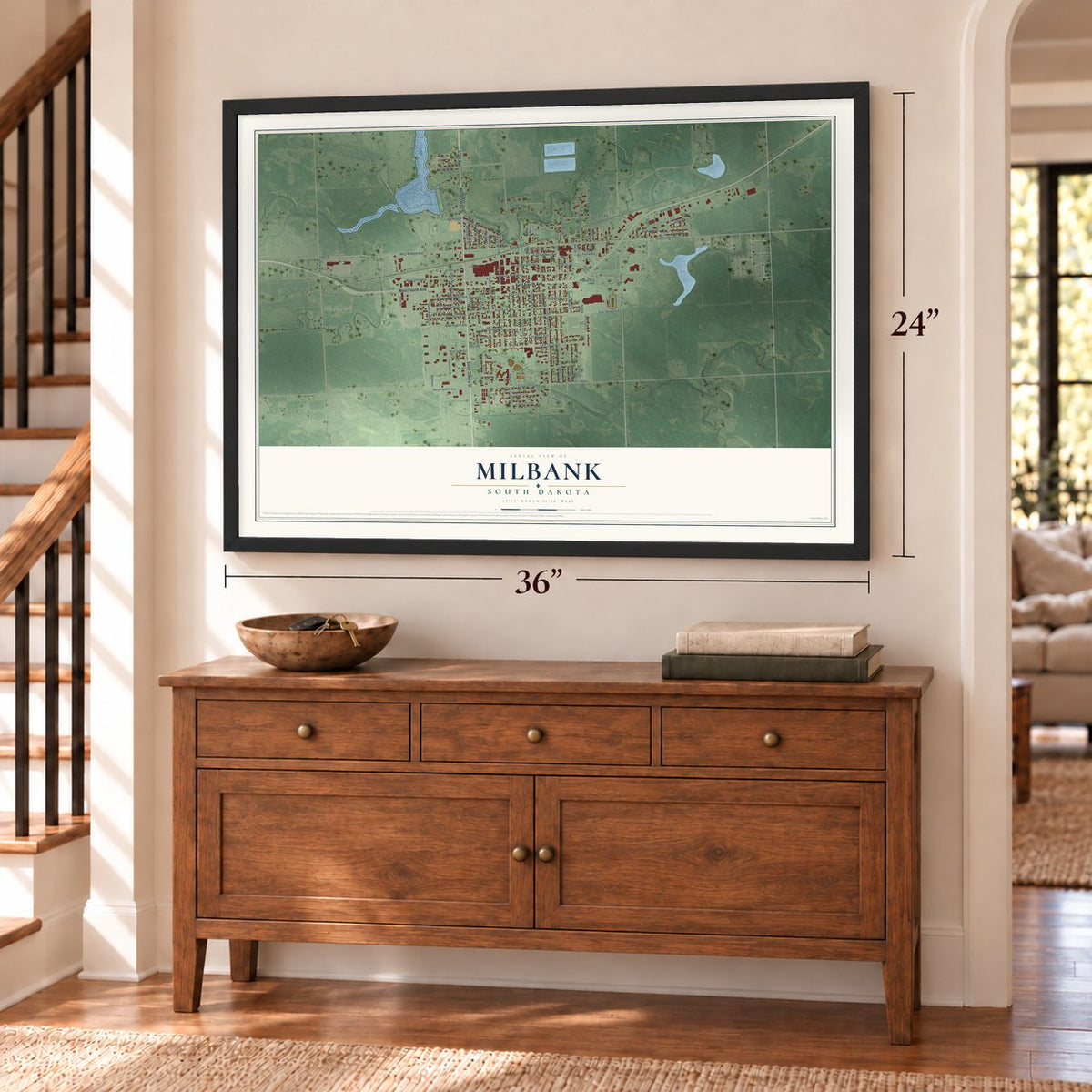 Milbank, South Dakota map, 24 x 36 inch print in a black frame above a dresser by a staircase