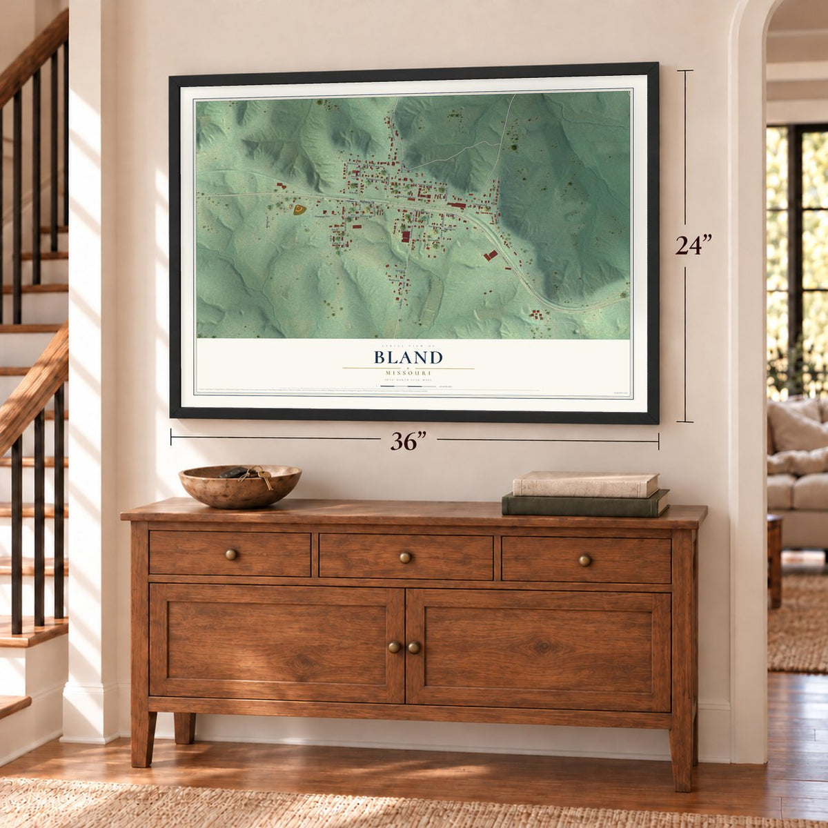 Bland, Missouri map, 24 x 36 inch print in a black frame above a dresser by a staircase
