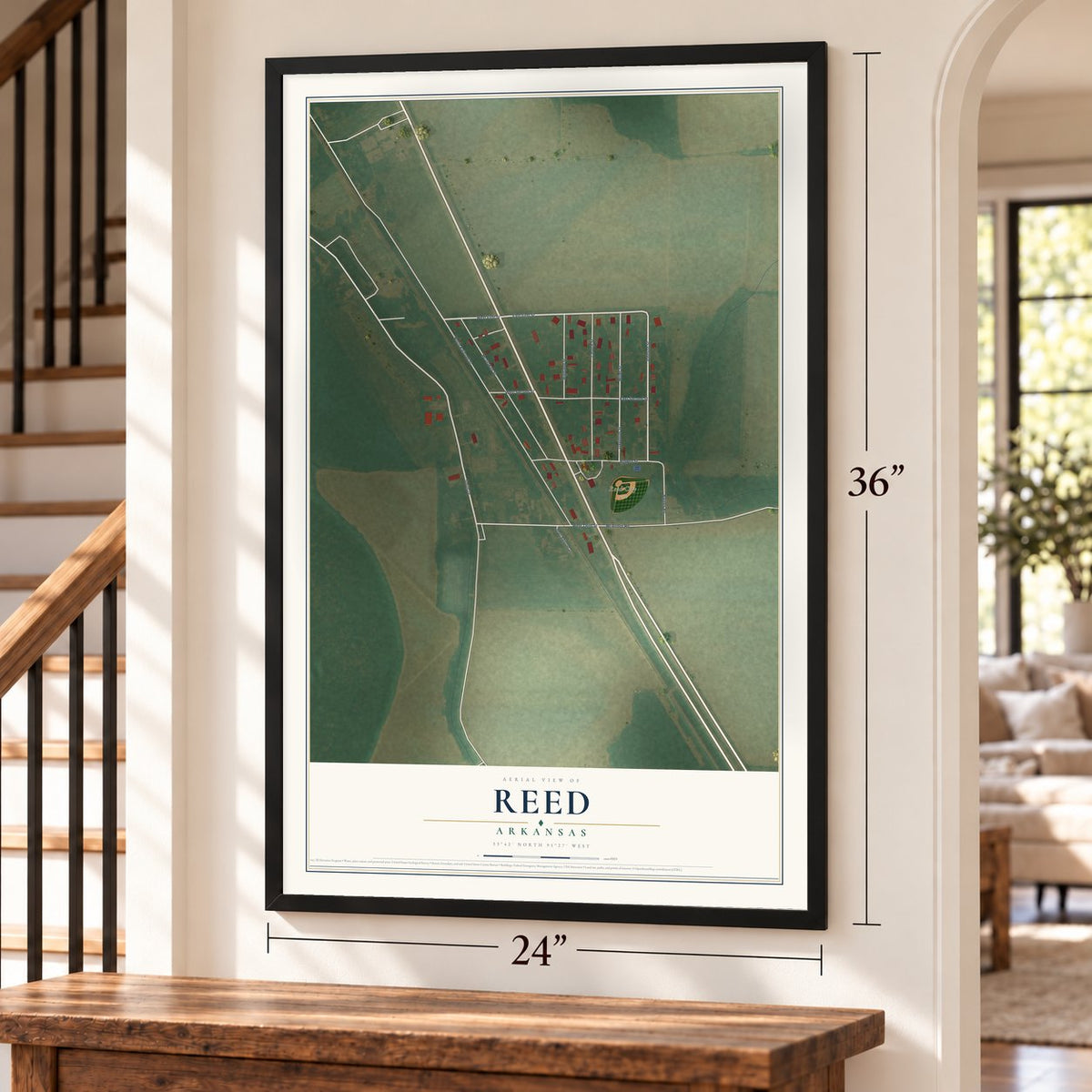 Reed, Arkansas map, 24 x 36 inch print in a black frame by a staircase