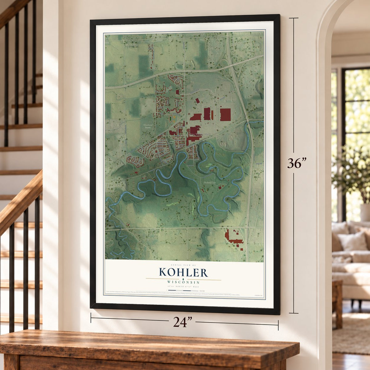 Kohler, Wisconsin map, 24 x 36 inch print in a black frame by a staircase