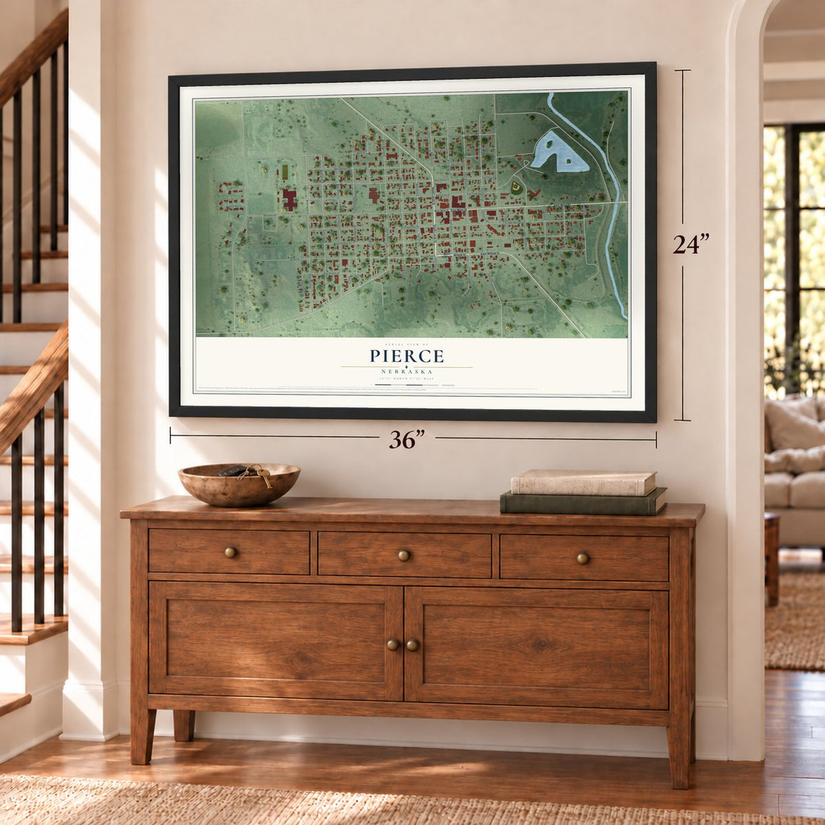 Pierce, Nebraska map, 24 x 36 inch print in a black frame above a dresser by a staircase