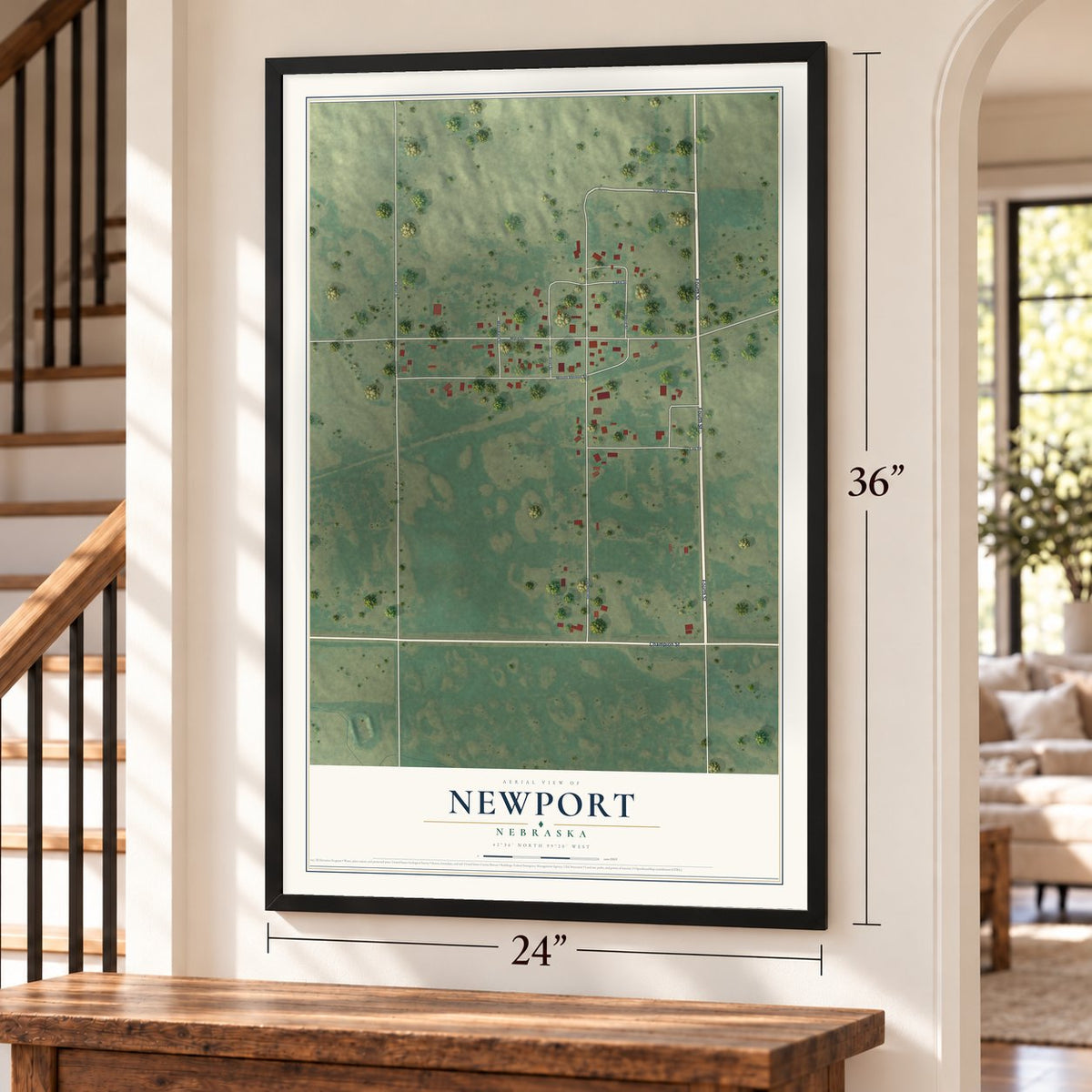 Newport, Nebraska map, 24 x 36 inch print in a black frame by a staircase