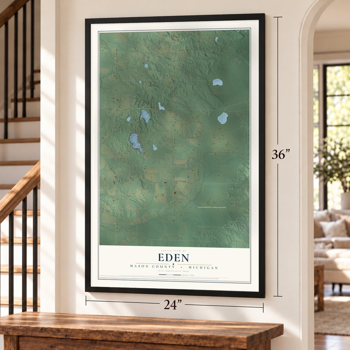 Eden, Mason County, Michigan map, 24 x 36 inch print in a black frame by a staircase