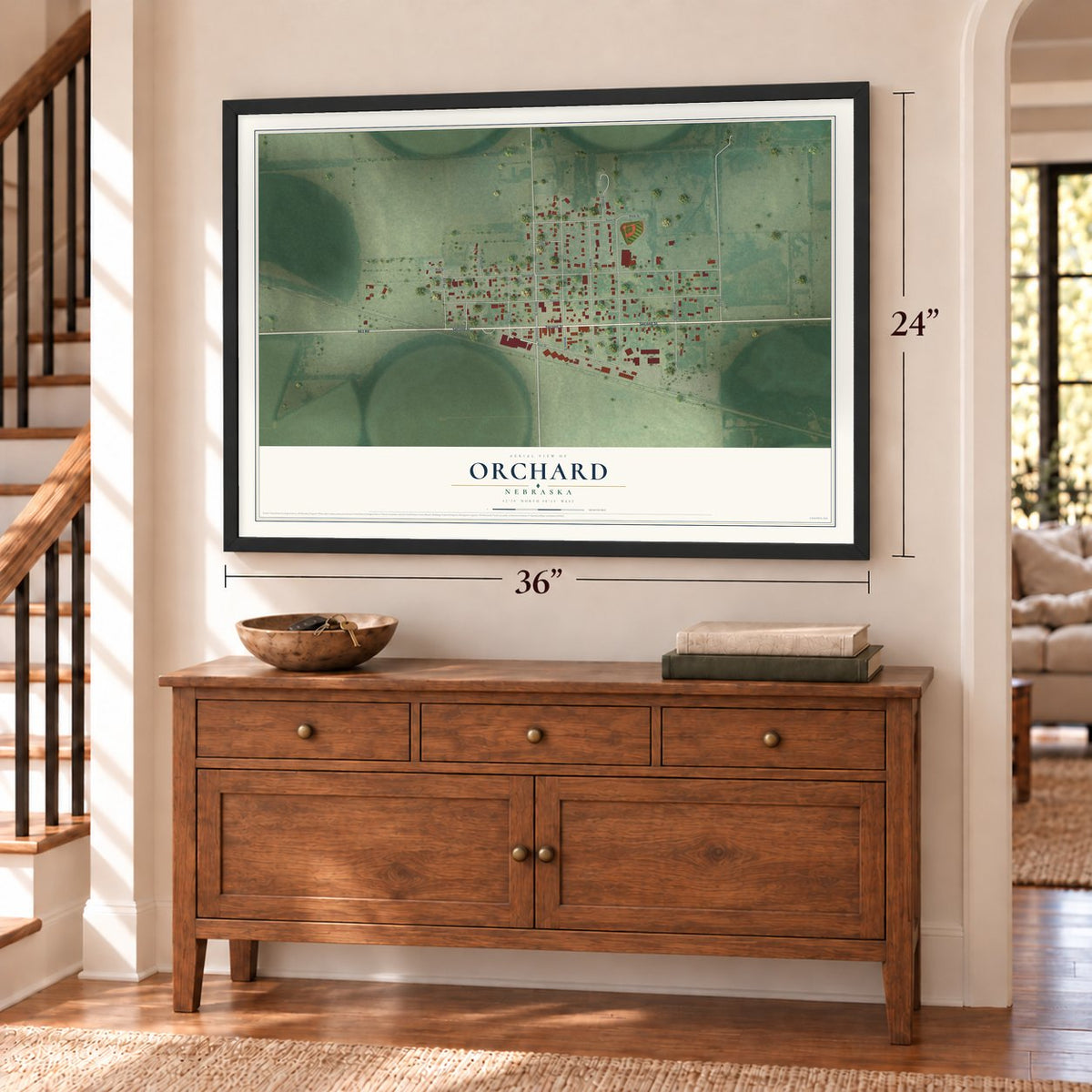 Orchard, Nebraska map, 24 x 36 inch print in a black frame above a dresser by a staircase