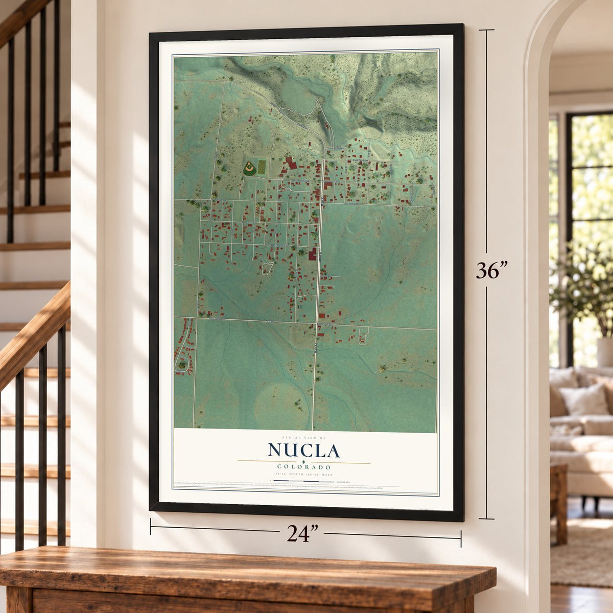 Nucla, Colorado map, 24 x 36 inch print in a black frame by a staircase