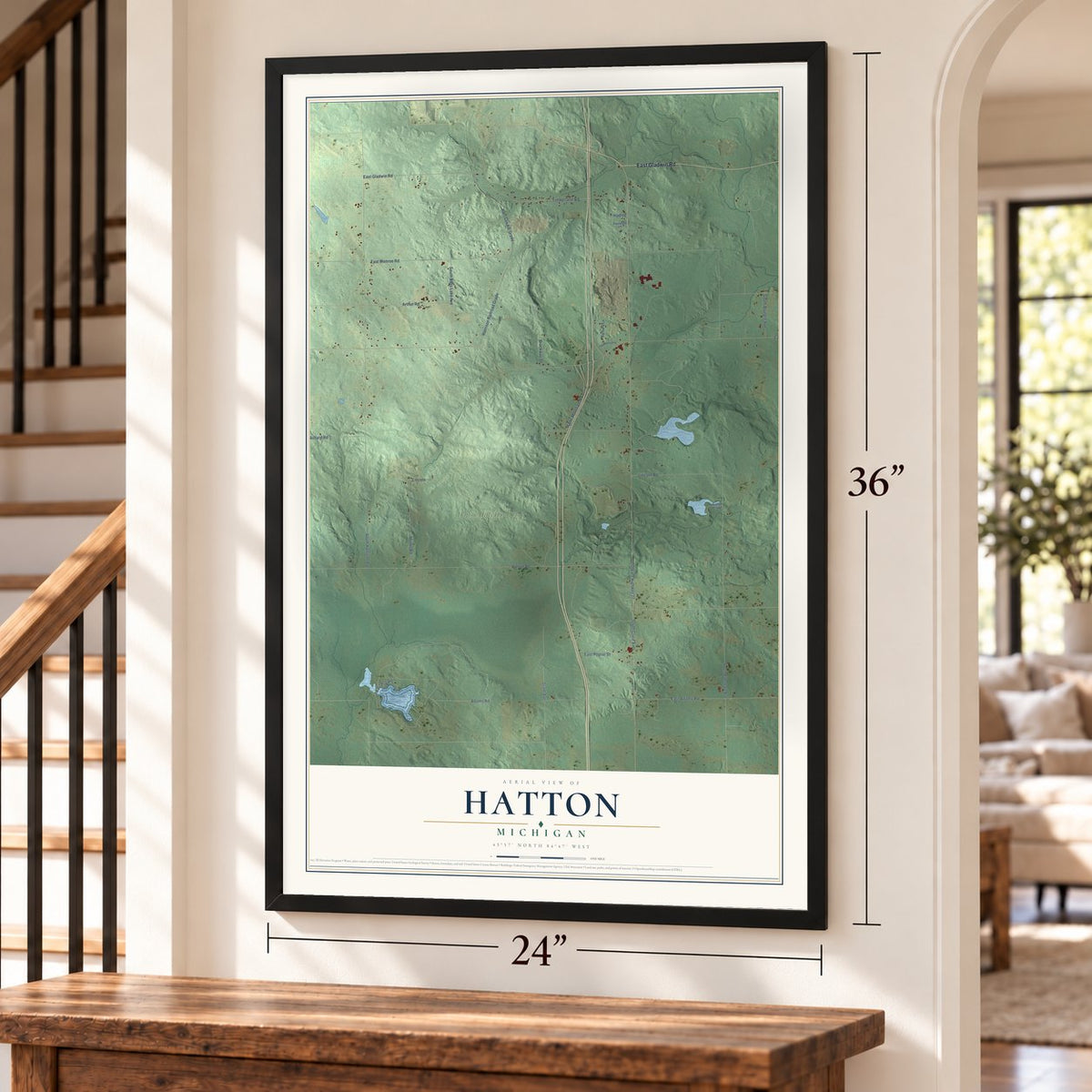 Hatton, Michigan map, 24 x 36 inch print in a black frame by a staircase