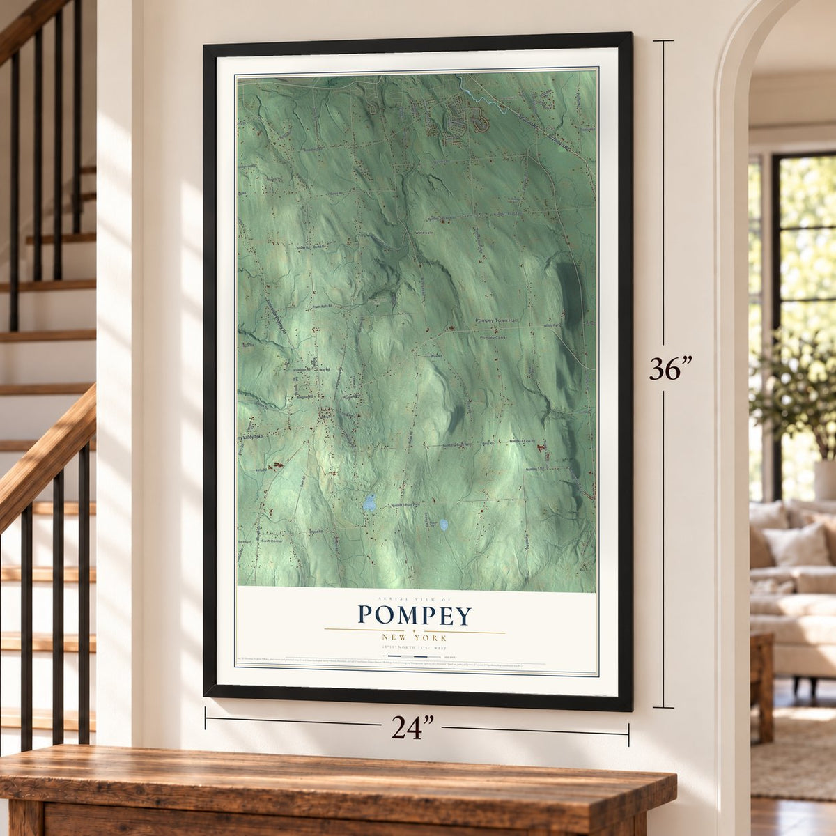 Pompey, New York map, 24 x 36 inch print in a black frame by a staircase