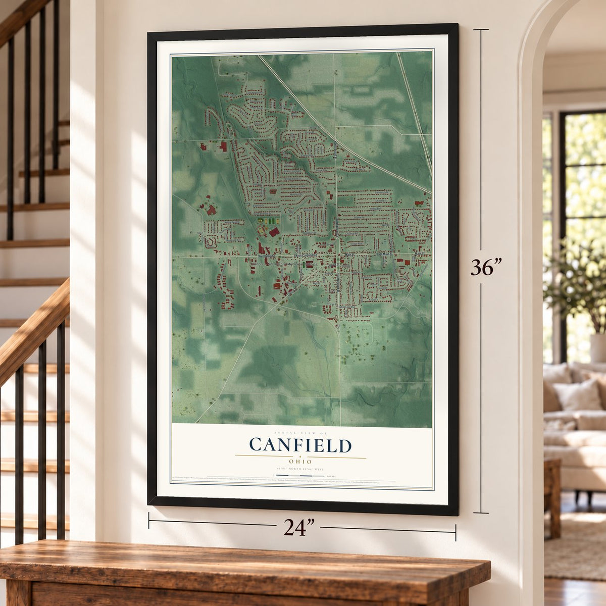 Canfield, Ohio map, 24 x 36 inch print in a black frame by a staircase