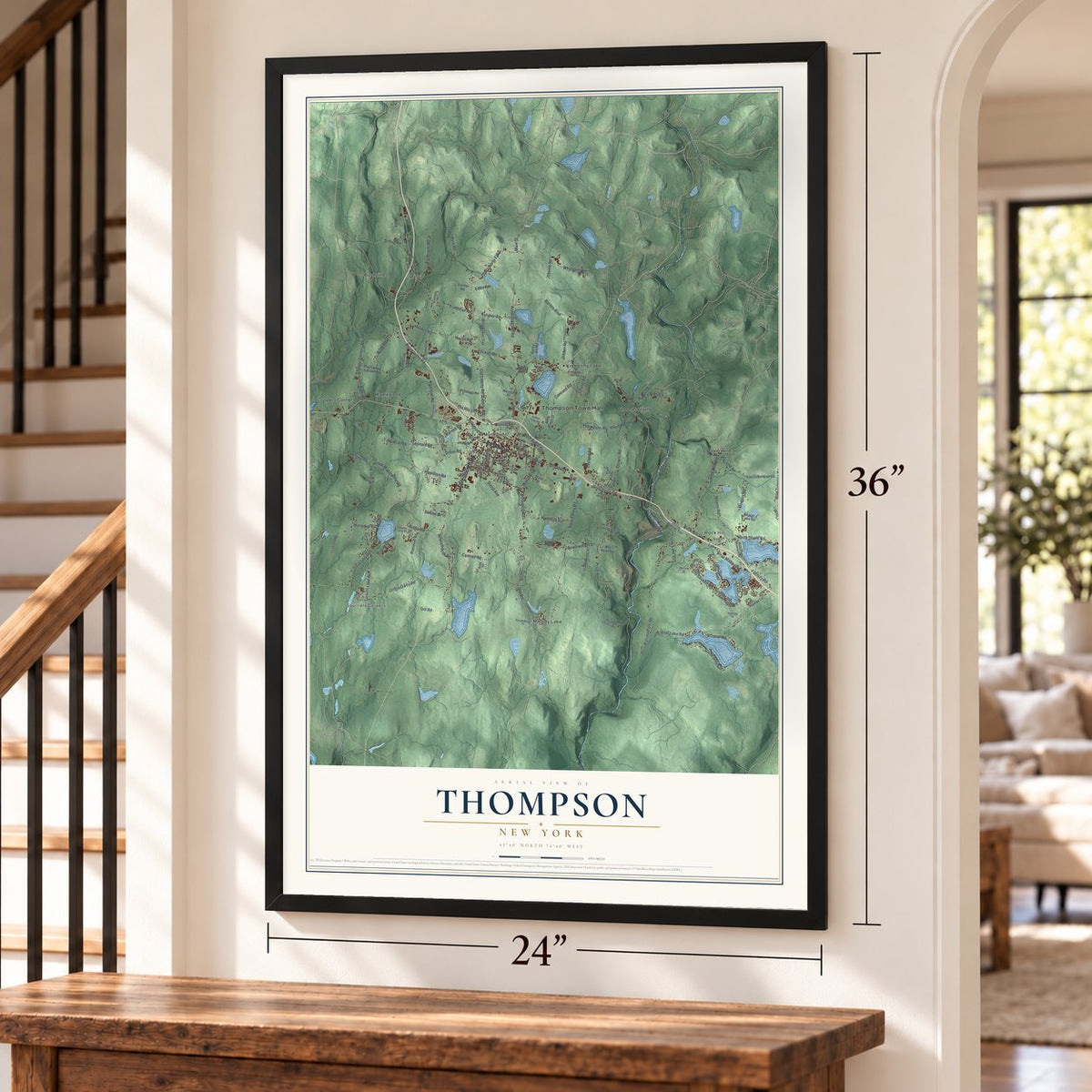 Thompson, New York map, 24 x 36 inch print in a black frame by a staircase