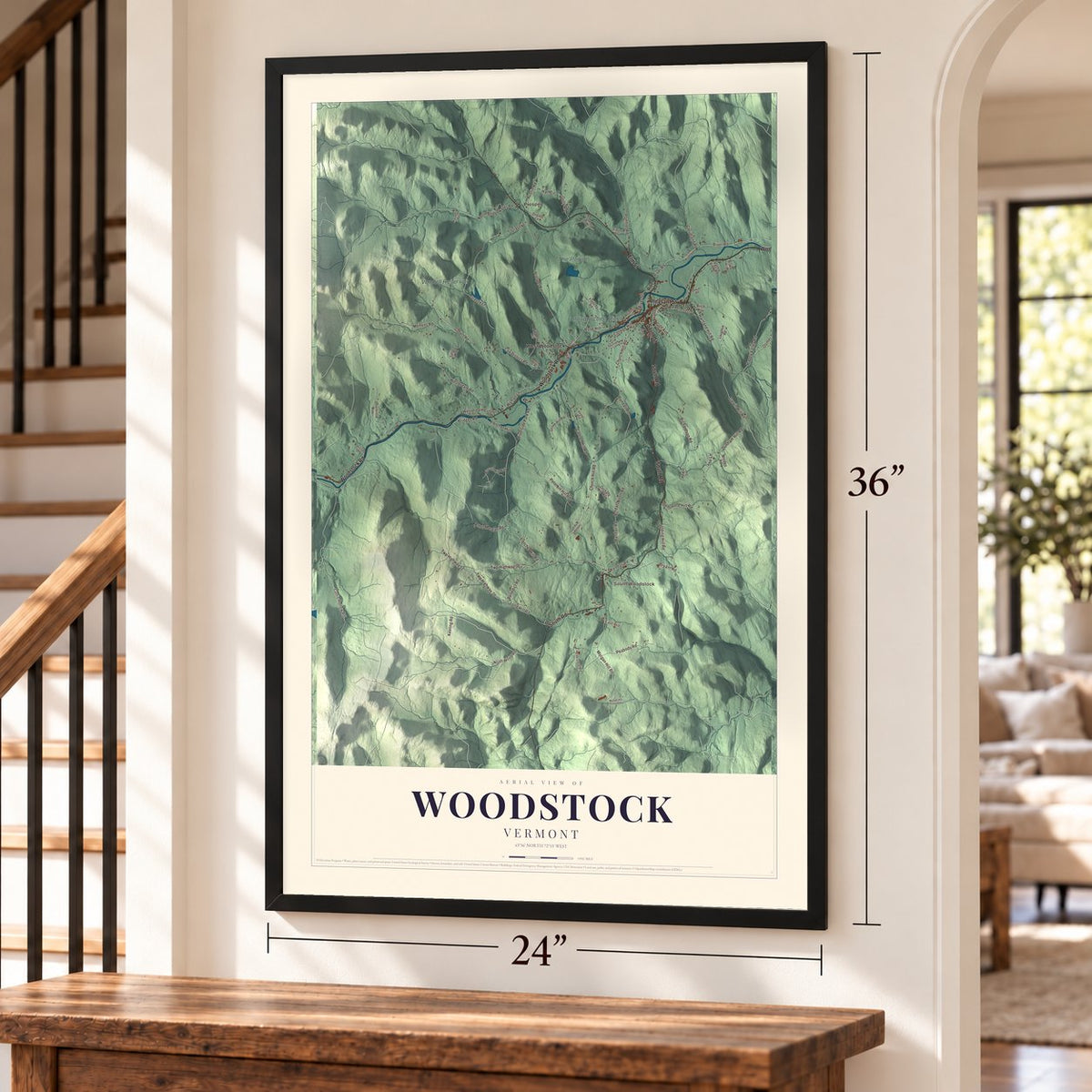 Woodstock, Vermont map, 24 x 36 inch print in a black frame by a staircase