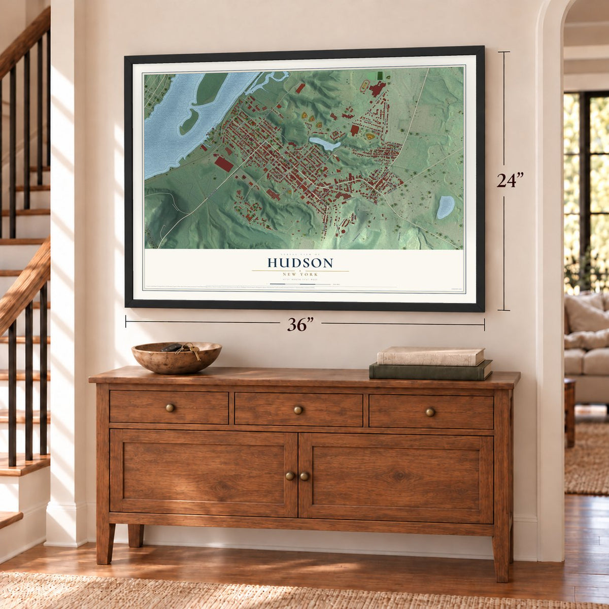 Hudson, New York map, 24 x 36 inch print in a black frame above a dresser by a staircase