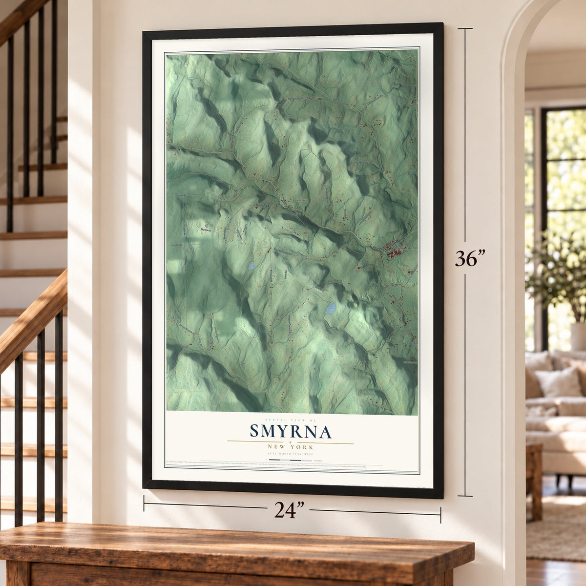 Smyrna, New York map, 24 x 36 inch print in a black frame by a staircase