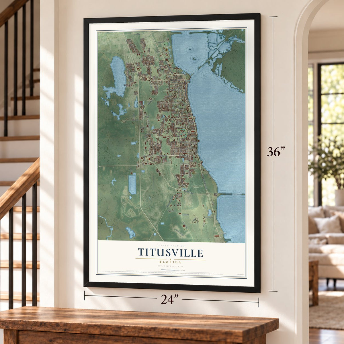 Titusville, Florida map, 24 x 36 inch print in a black frame by a staircase