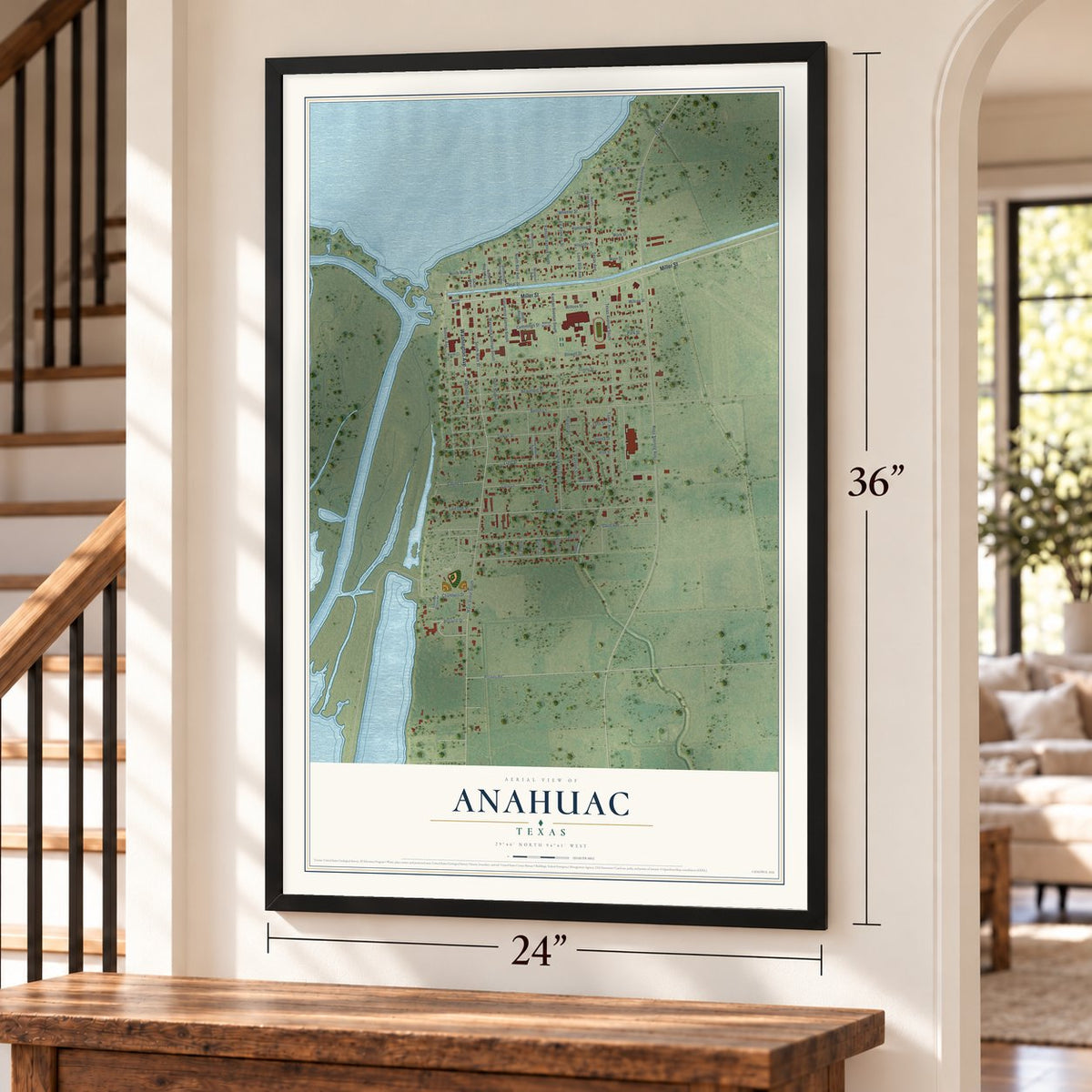 Anahuac, Texas map, 24 x 36 inch print in a black frame by a staircase