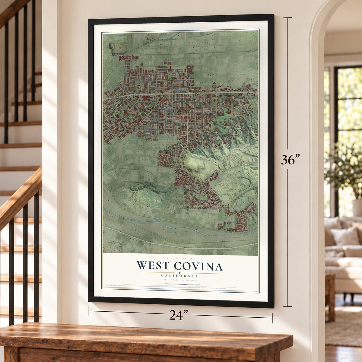 West Covina, California map, 24 x 36 inch print in a black frame by a staircase