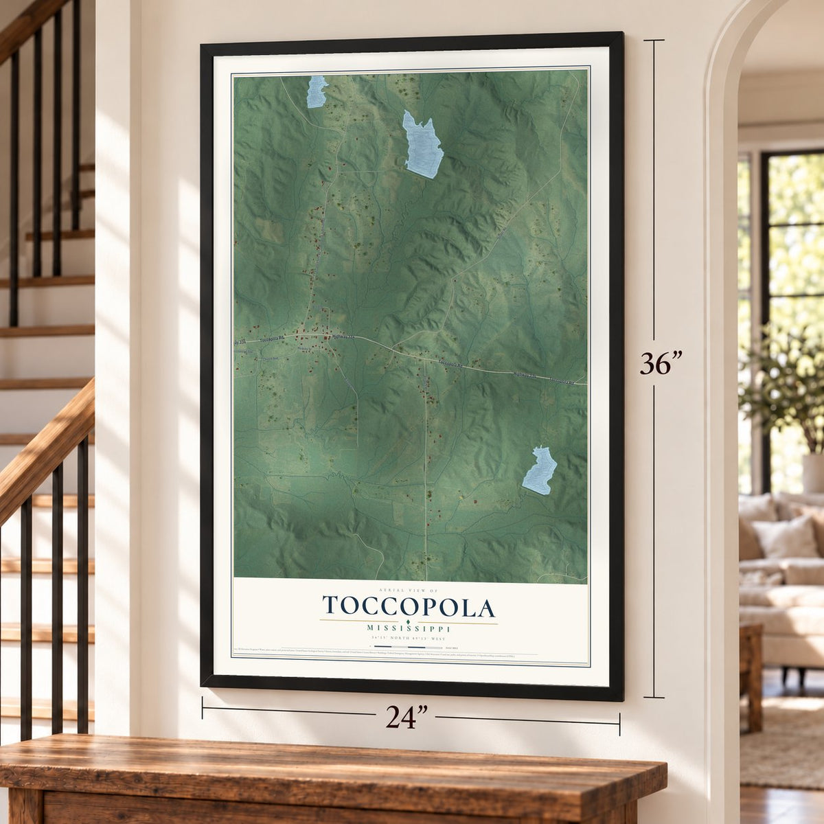 Toccopola, Mississippi map, 24 x 36 inch print in a black frame by a staircase