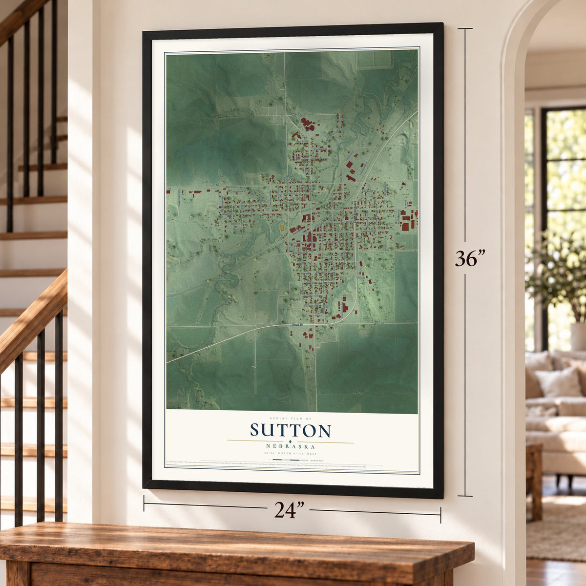 Sutton, Nebraska map, 24 x 36 inch print in a black frame by a staircase
