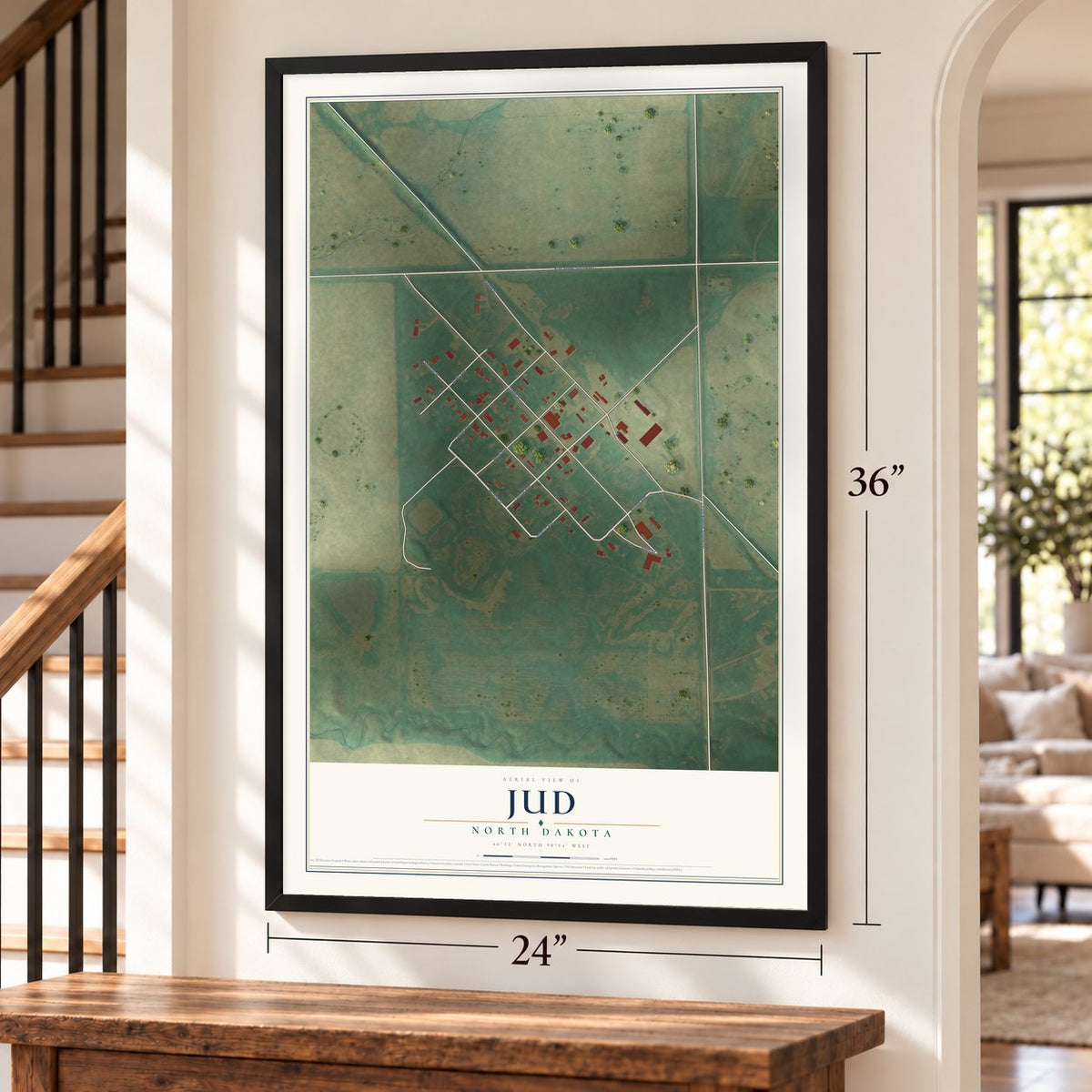 Jud, North Dakota map, 24 x 36 inch print in a black frame by a staircase