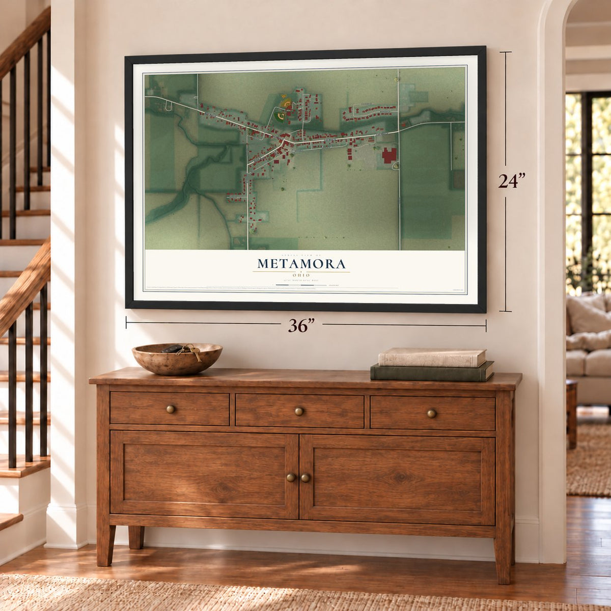 Metamora, Ohio map, 24 x 36 inch print in a black frame above a dresser by a staircase