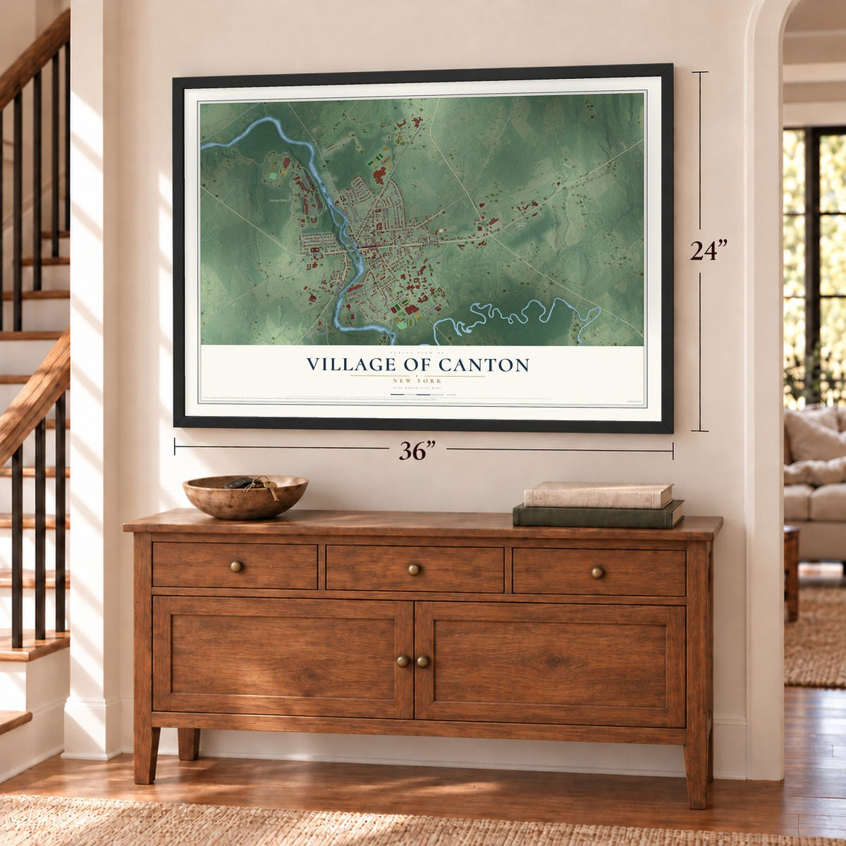 Village of Canton, New York map, 24 x 36 inch print in a black frame above a dresser by a staircase