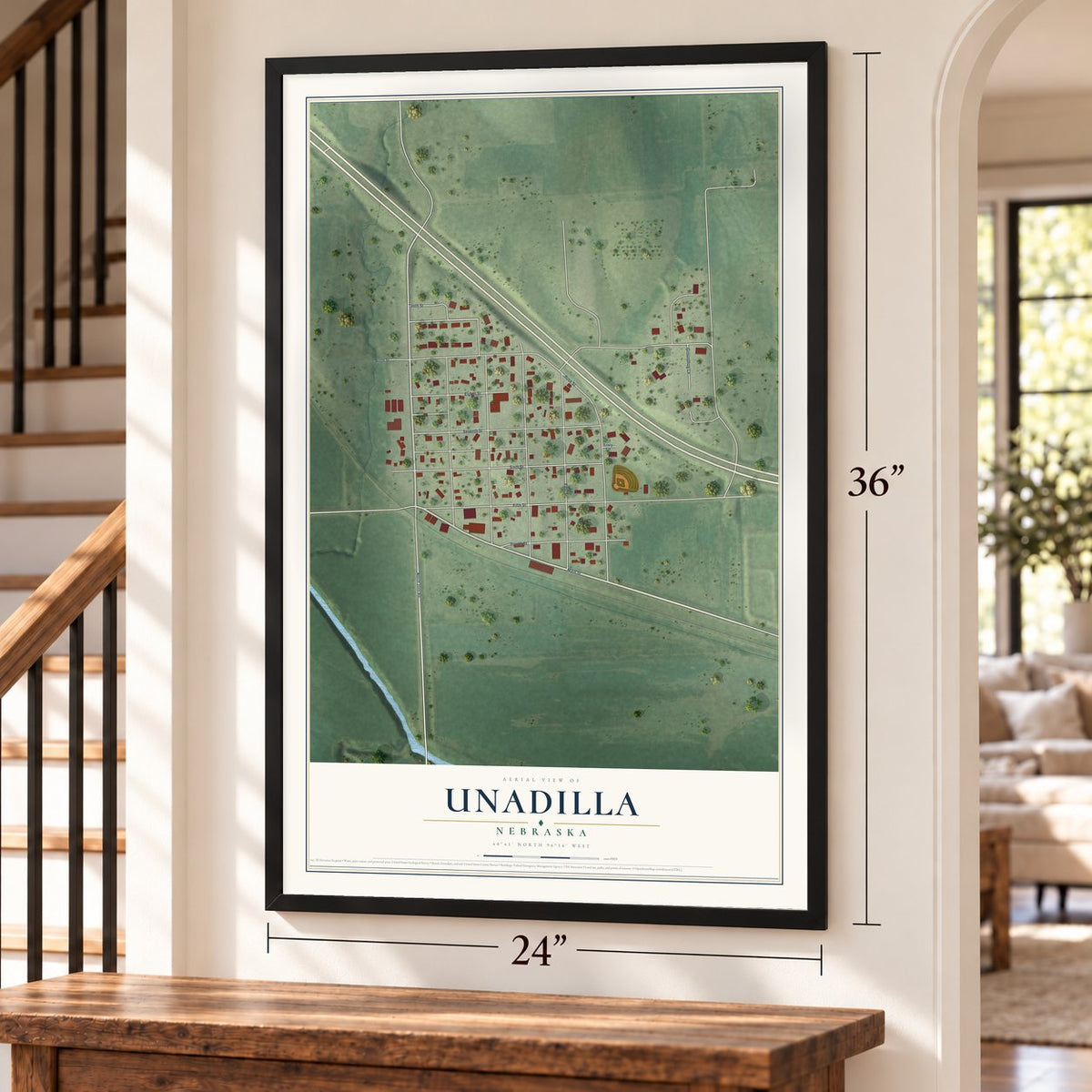Unadilla, Nebraska map, 24 x 36 inch print in a black frame by a staircase
