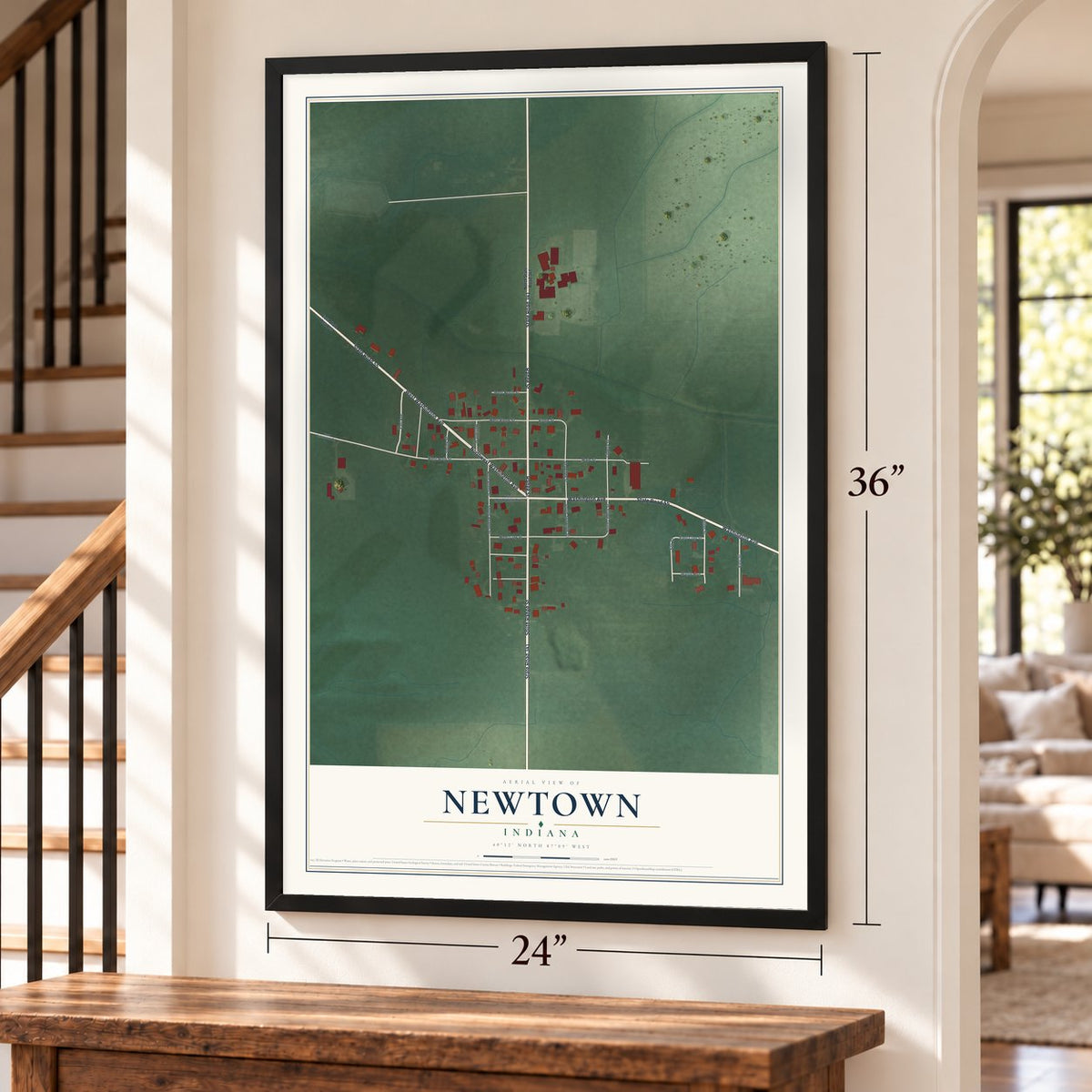 Newtown, Indiana map, 24 x 36 inch print in a black frame by a staircase