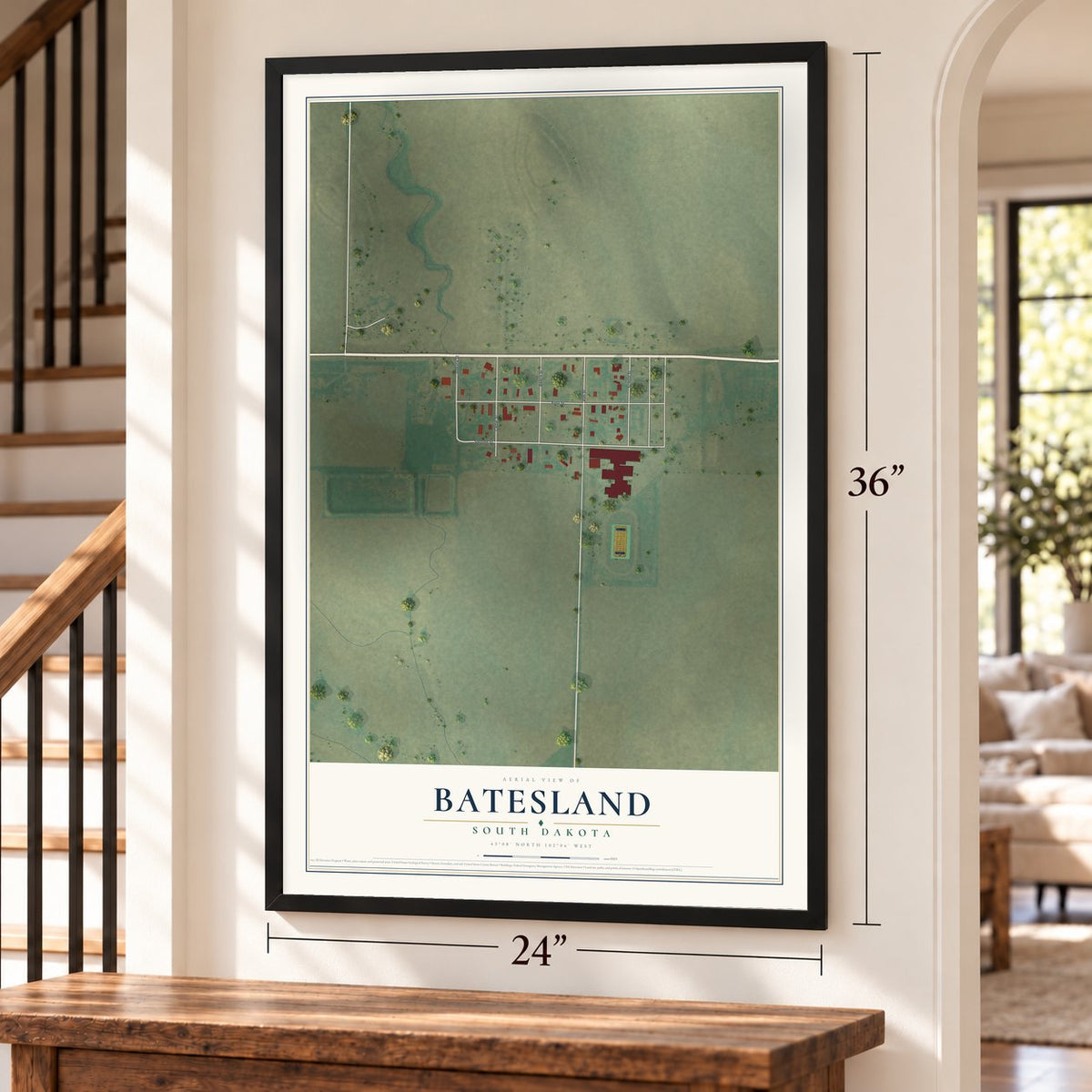 Batesland, South Dakota map, 24 x 36 inch print in a black frame by a staircase