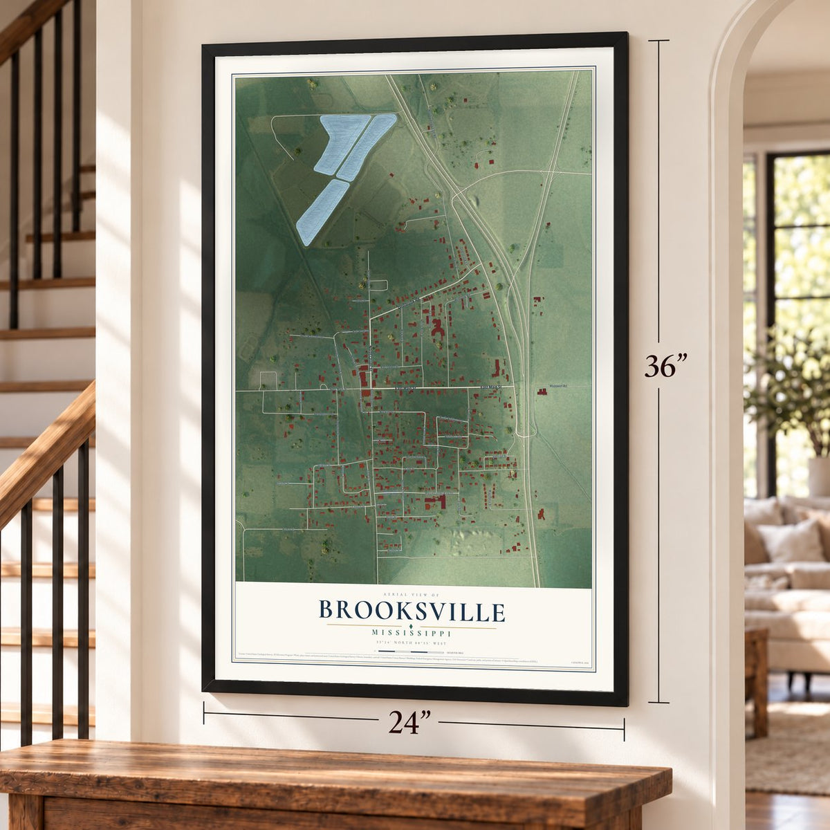 Brooksville, Mississippi map, 24 x 36 inch print in a black frame by a staircase