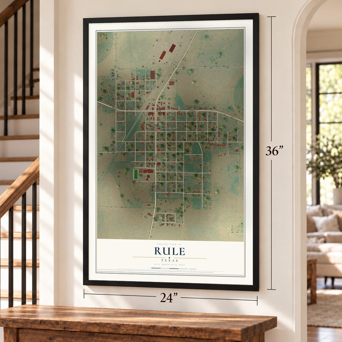 Rule, Texas map, 24 x 36 inch print in a black frame by a staircase
