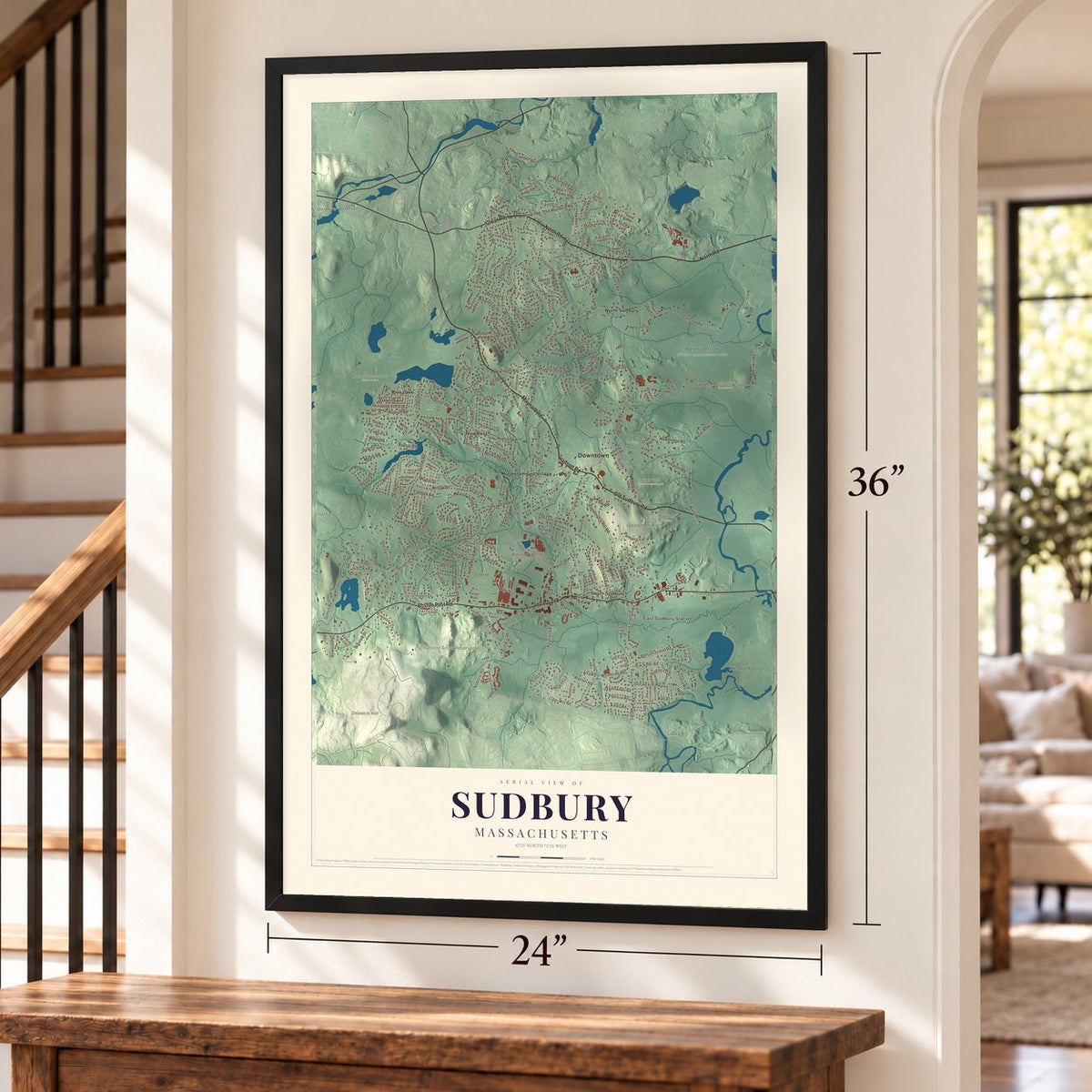 Sudbury, Massachusetts map, 24 x 36 inch print in a black frame by a staircase