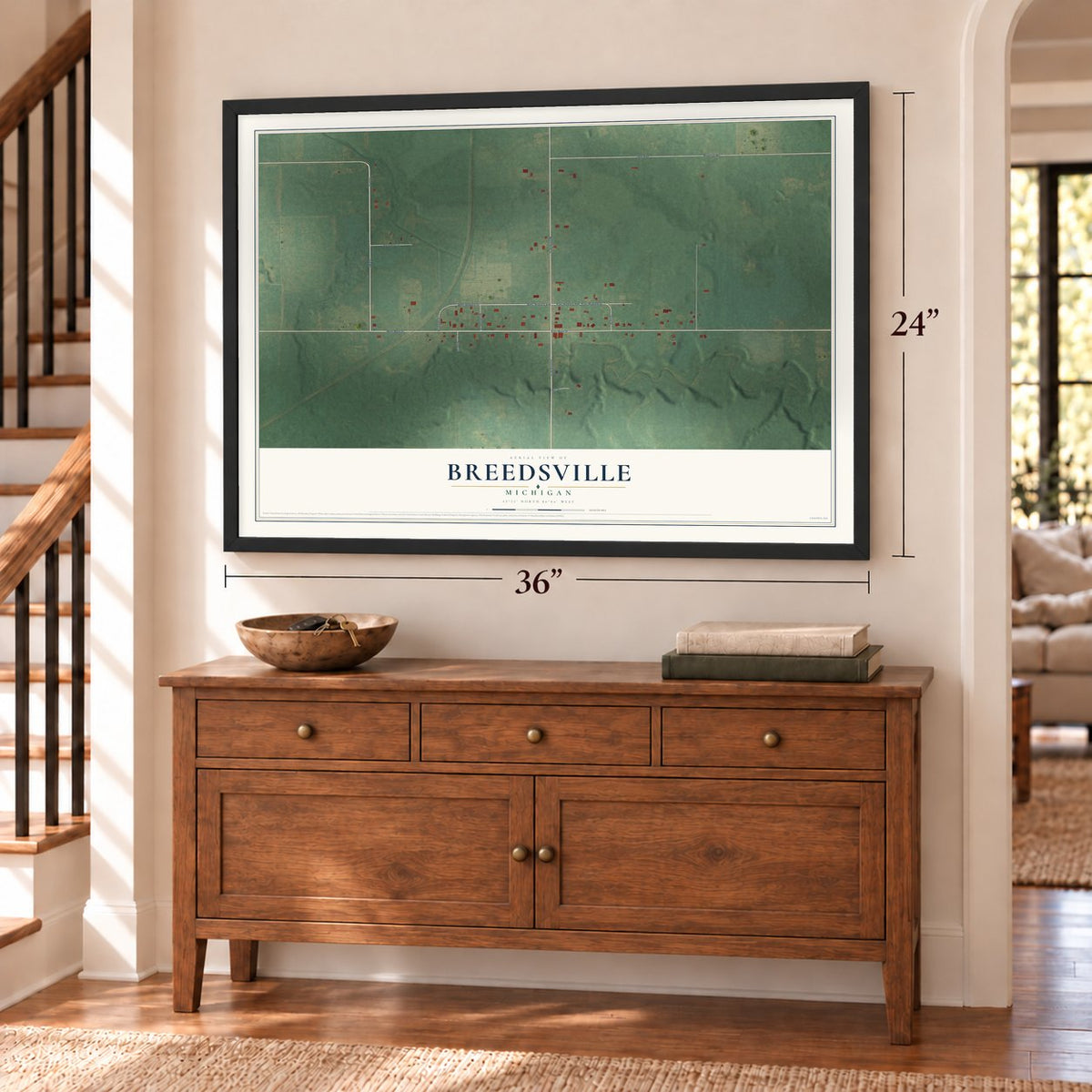 Breedsville, Michigan map, 24 x 36 inch print in a black frame above a dresser by a staircase