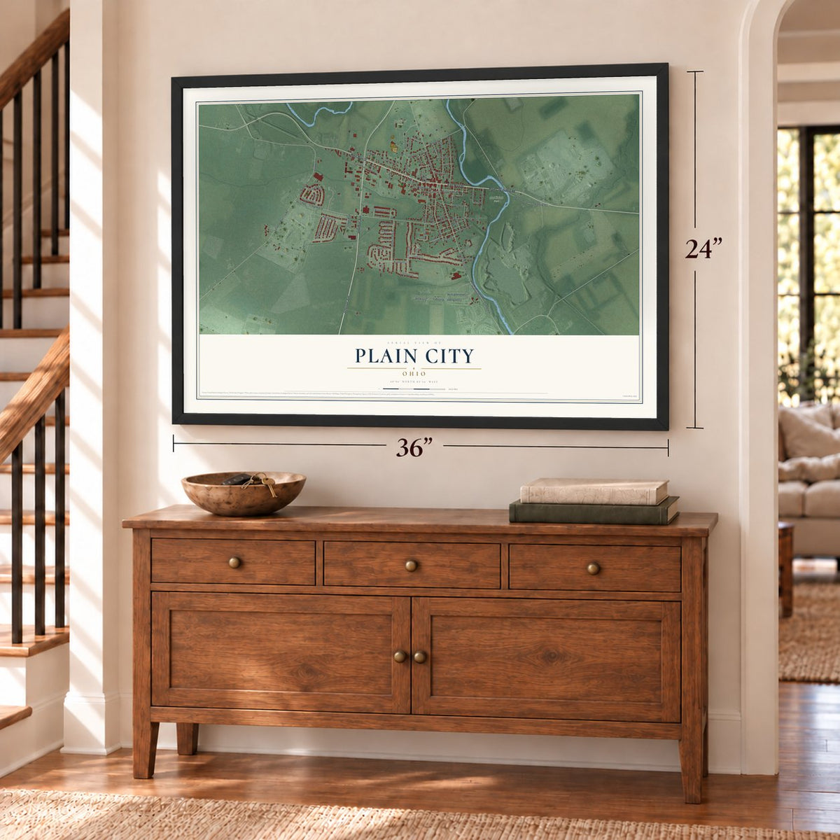 Plain City, Ohio map, 24 x 36 inch print in a black frame above a dresser by a staircase