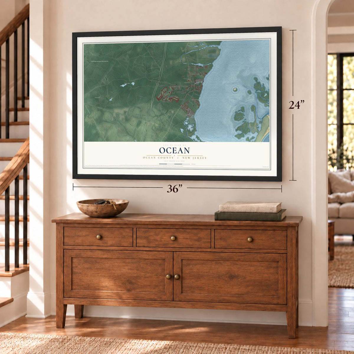 Ocean, Ocean County, New Jersey map, 24 x 36 inch print in a black frame above a dresser by a staircase