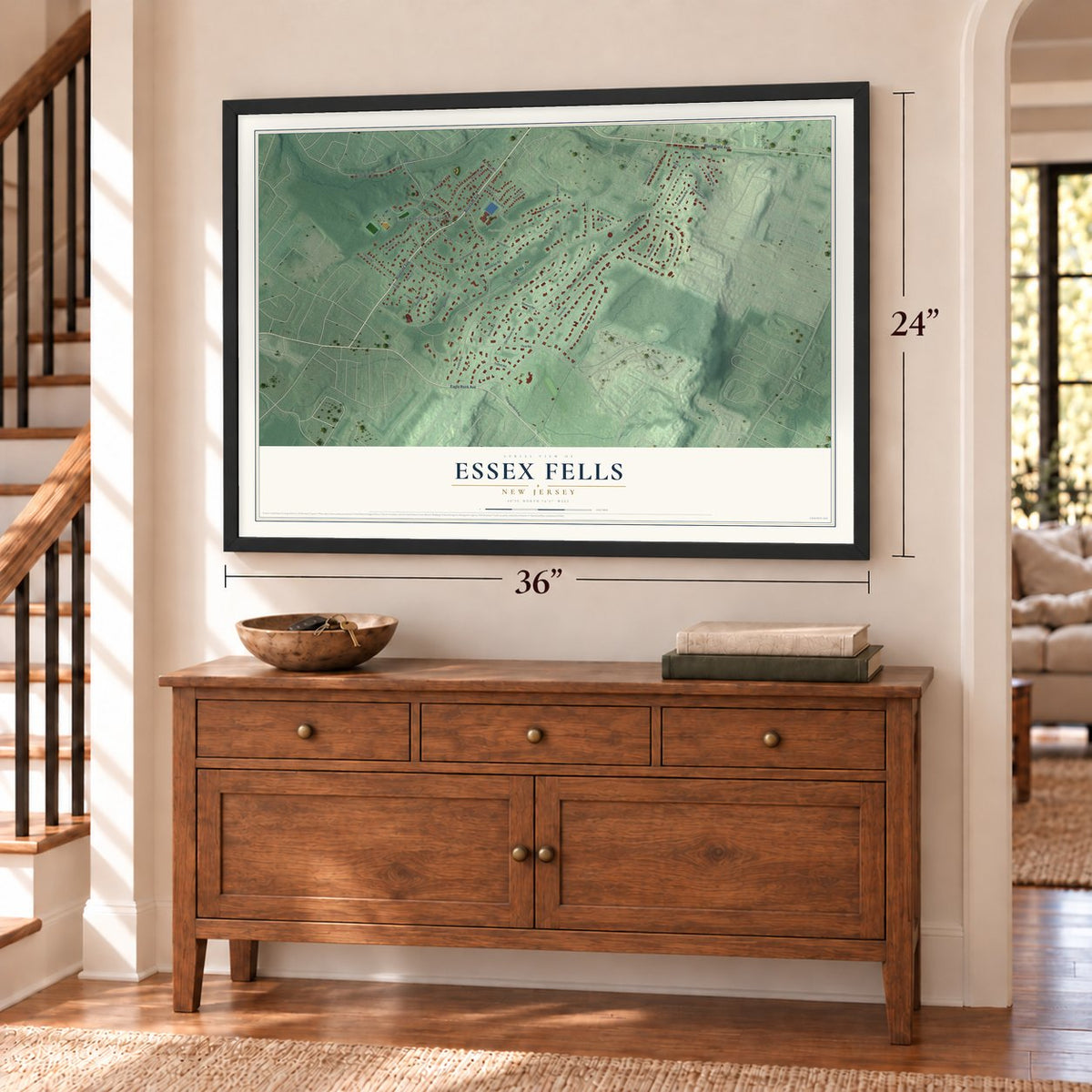 Essex Fells, New Jersey map, 24 x 36 inch print in a black frame above a dresser by a staircase