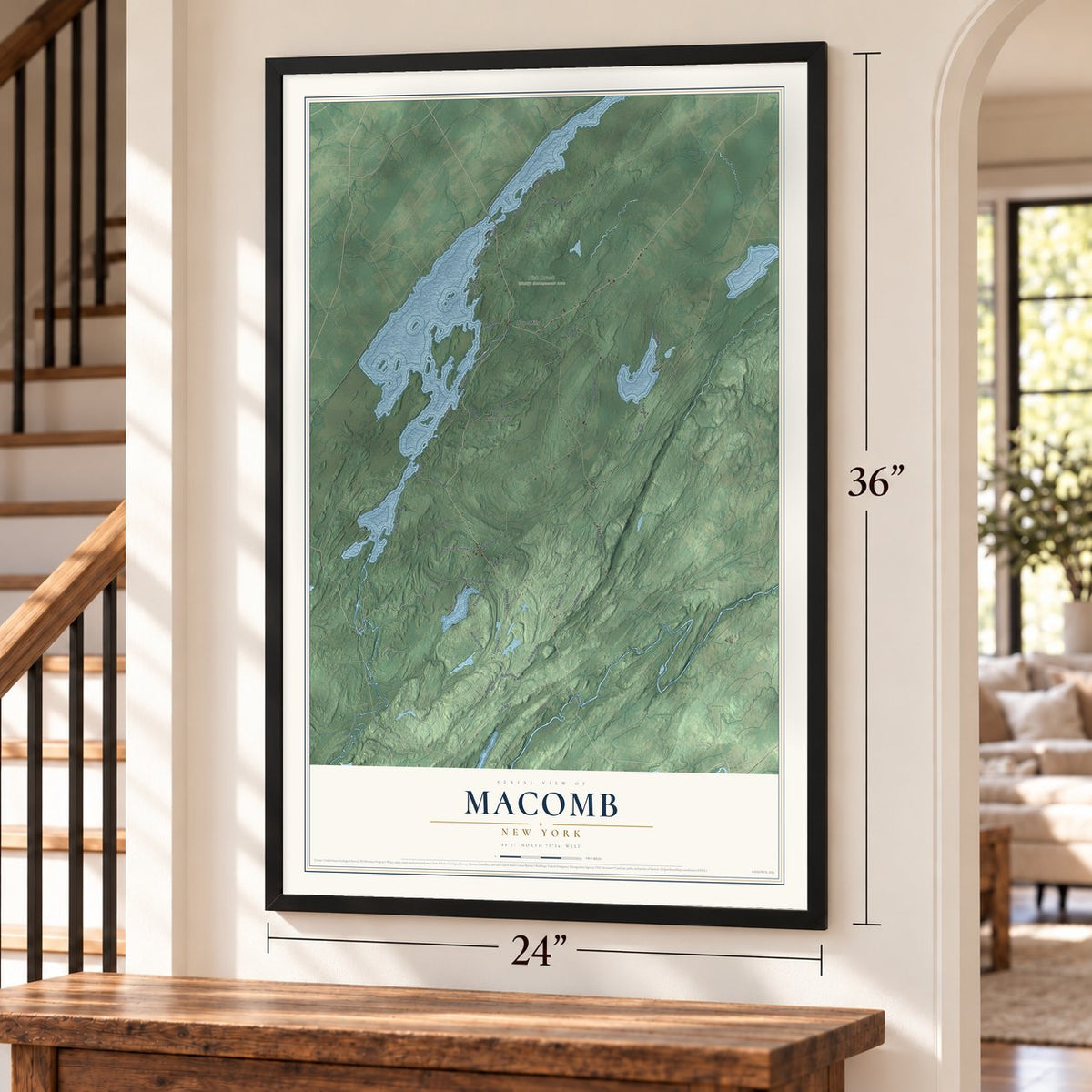 Macomb, New York map, 24 x 36 inch print in a black frame by a staircase