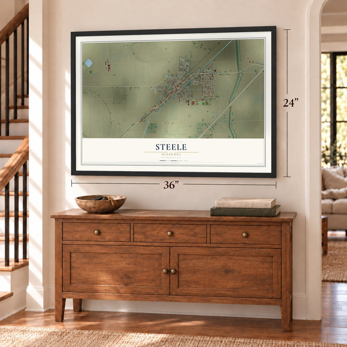 Steele, Missouri map, 24 x 36 inch print in a black frame above a dresser by a staircase