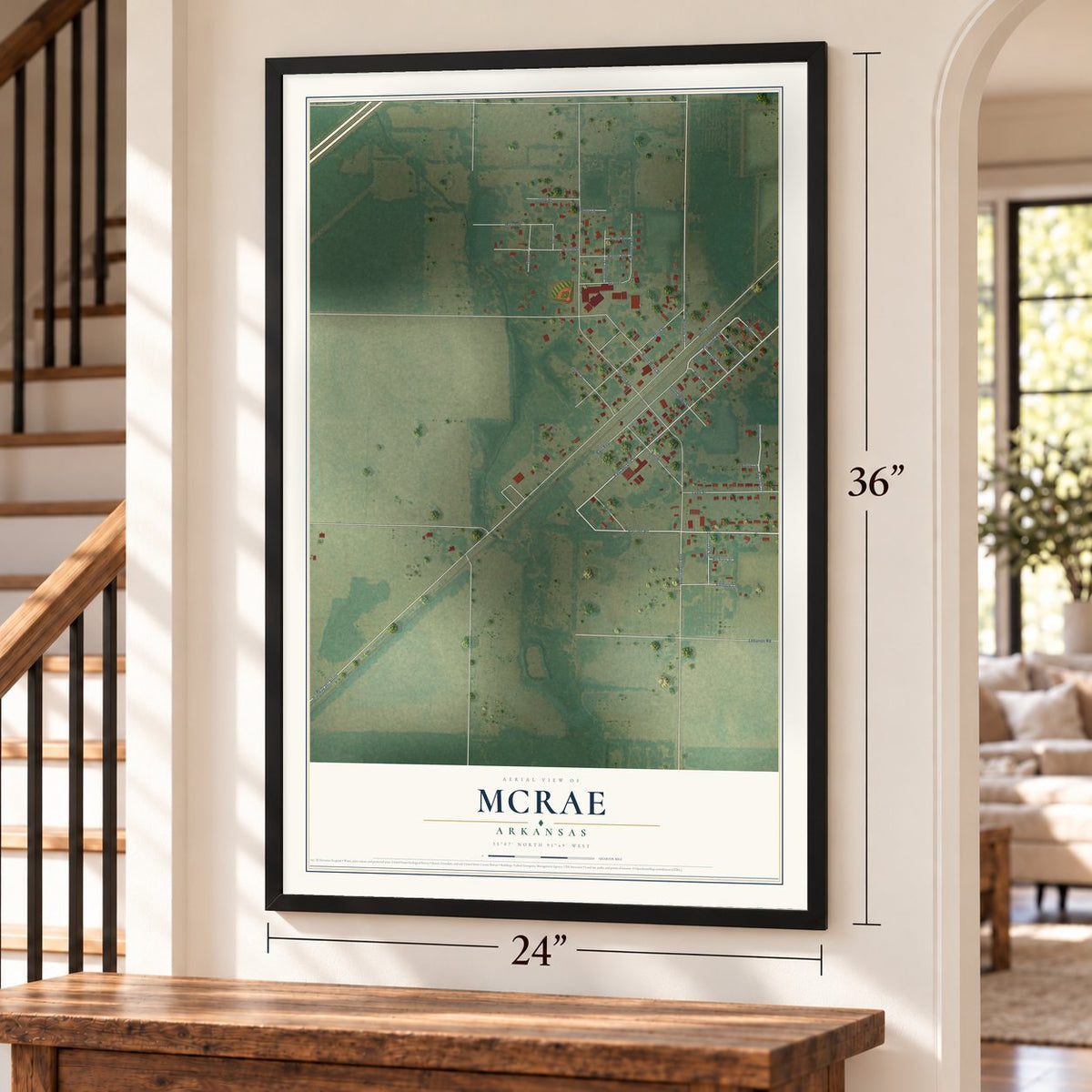 McRae, Arkansas map, 24 x 36 inch print in a black frame by a staircase