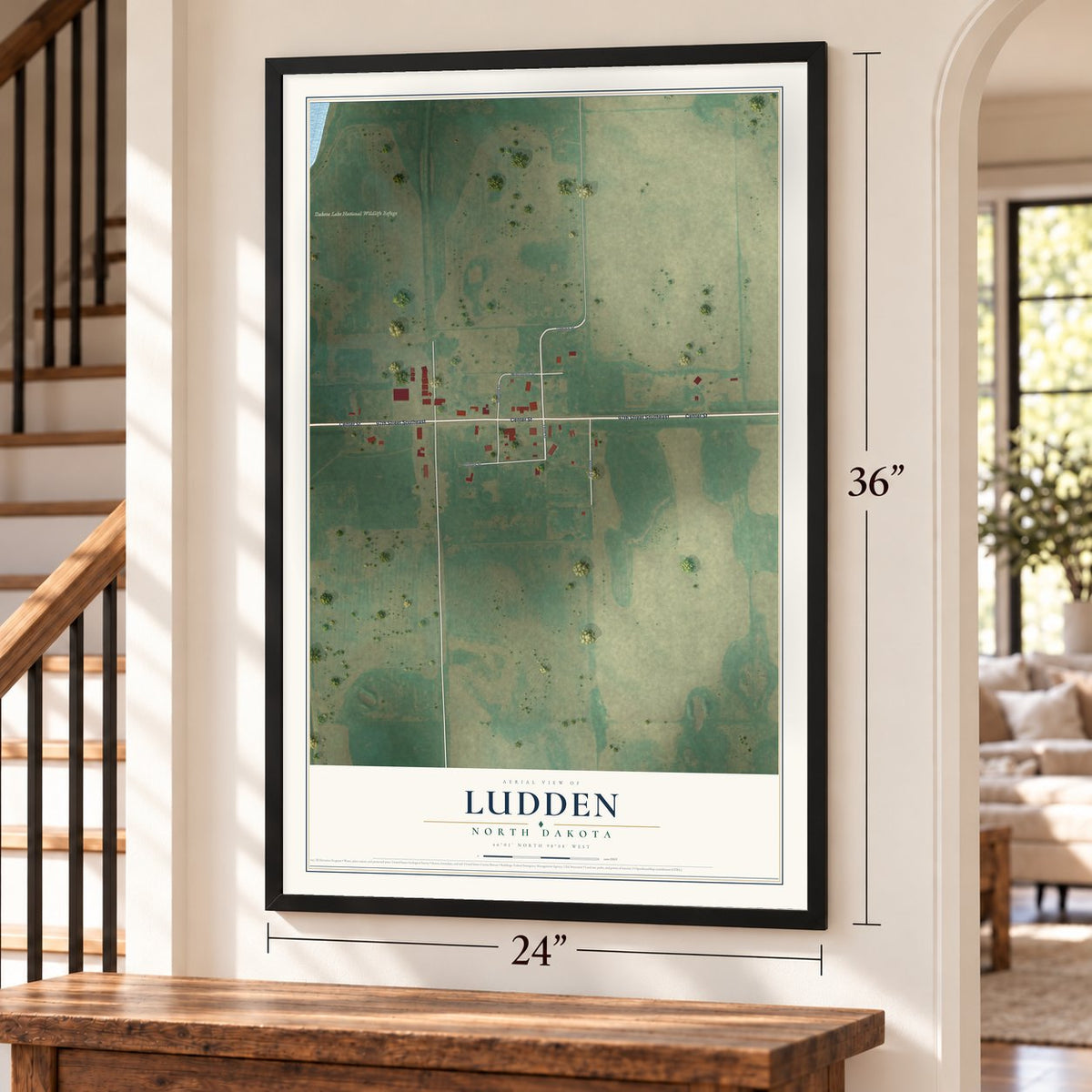Ludden, North Dakota map, 24 x 36 inch print in a black frame by a staircase