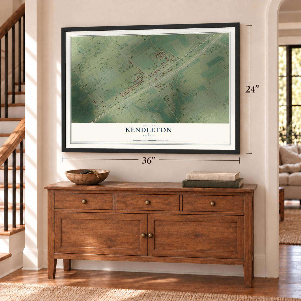 Kendleton, Texas map, 24 x 36 inch print in a black frame above a dresser by a staircase