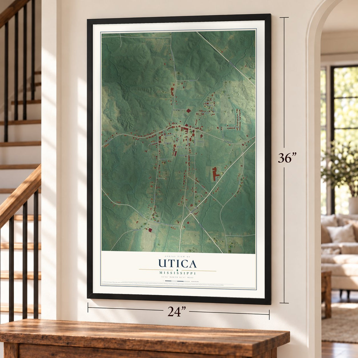 Utica, Mississippi map, 24 x 36 inch print in a black frame by a staircase