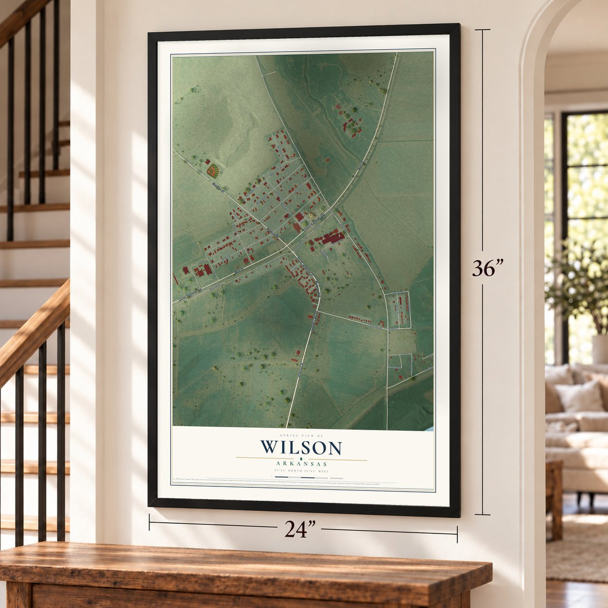 Wilson, Arkansas map, 24 x 36 inch print in a black frame by a staircase