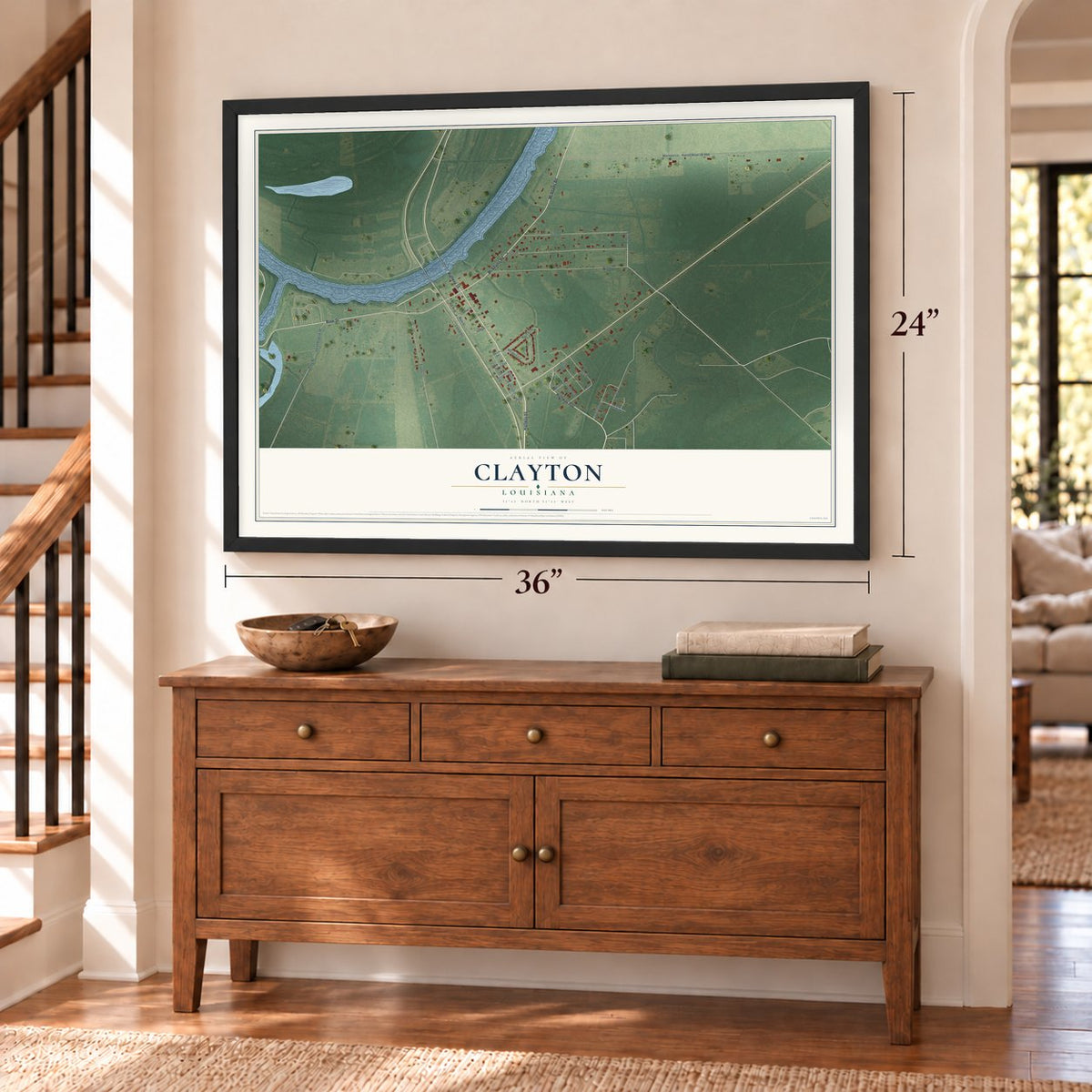 Clayton, Louisiana map, 24 x 36 inch print in a black frame above a dresser by a staircase