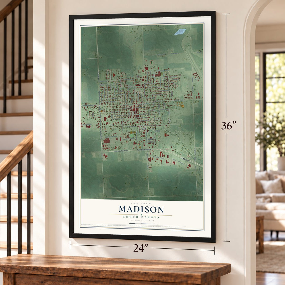 Madison, South Dakota map, 24 x 36 inch print in a black frame by a staircase