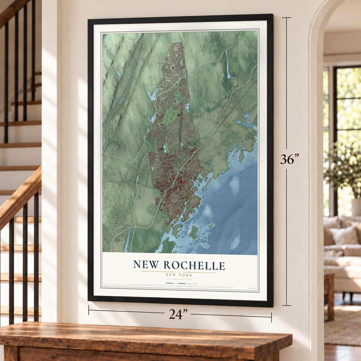 New Rochelle, New York map, 24 x 36 inch print in a black frame by a staircase