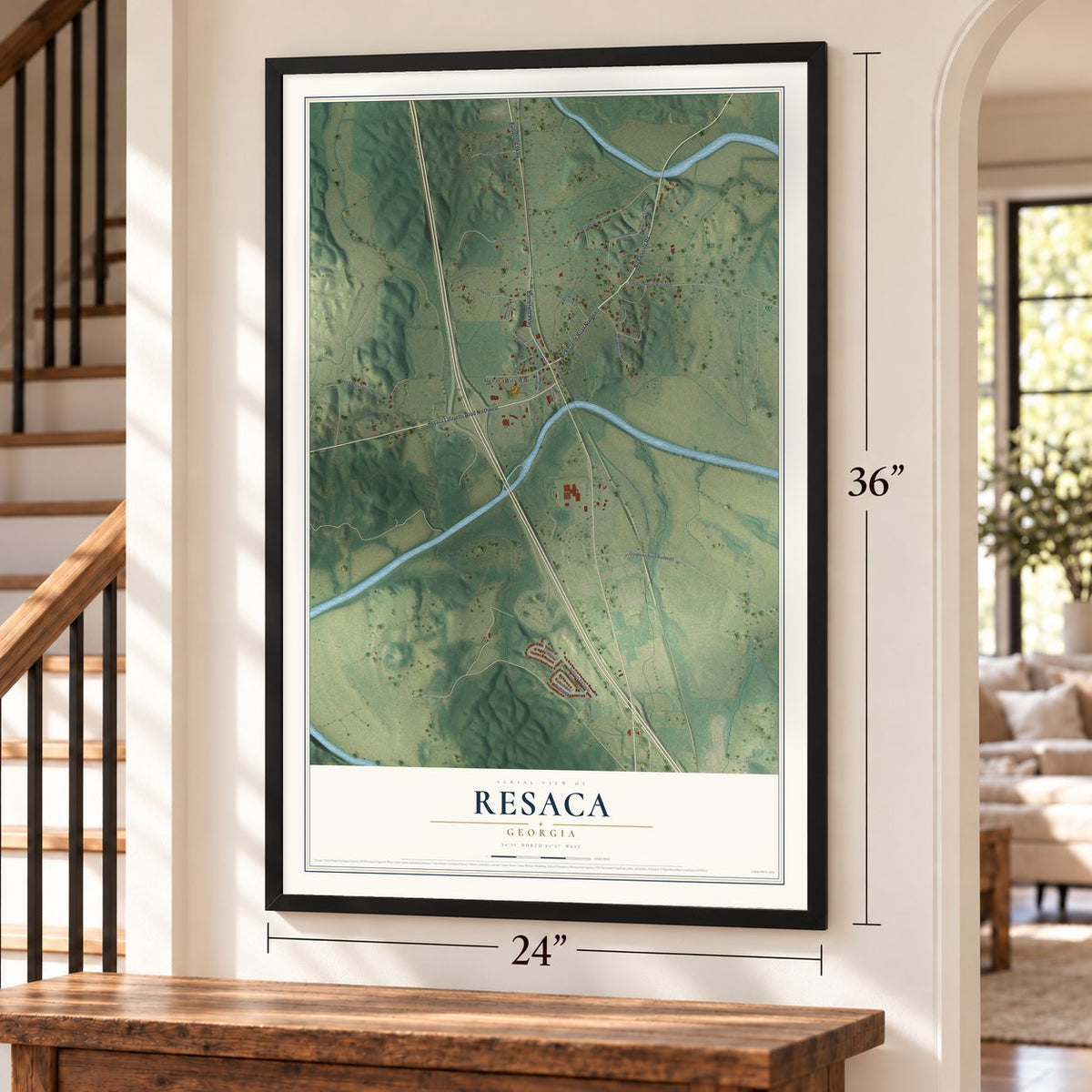 Resaca, Georgia map, 24 x 36 inch print in a black frame by a staircase