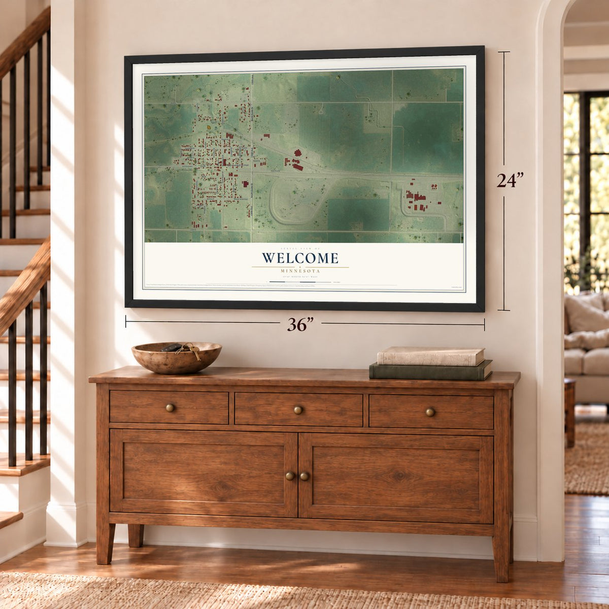 Welcome, Minnesota map, 24 x 36 inch print in a black frame above a dresser by a staircase