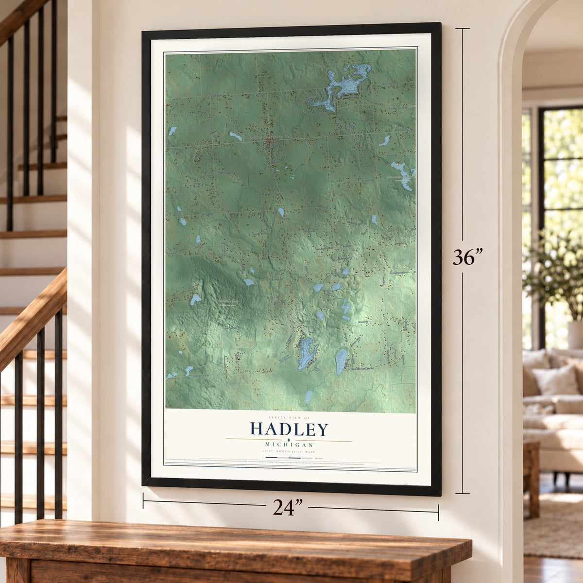 Hadley, Michigan map, 24 x 36 inch print in a black frame by a staircase