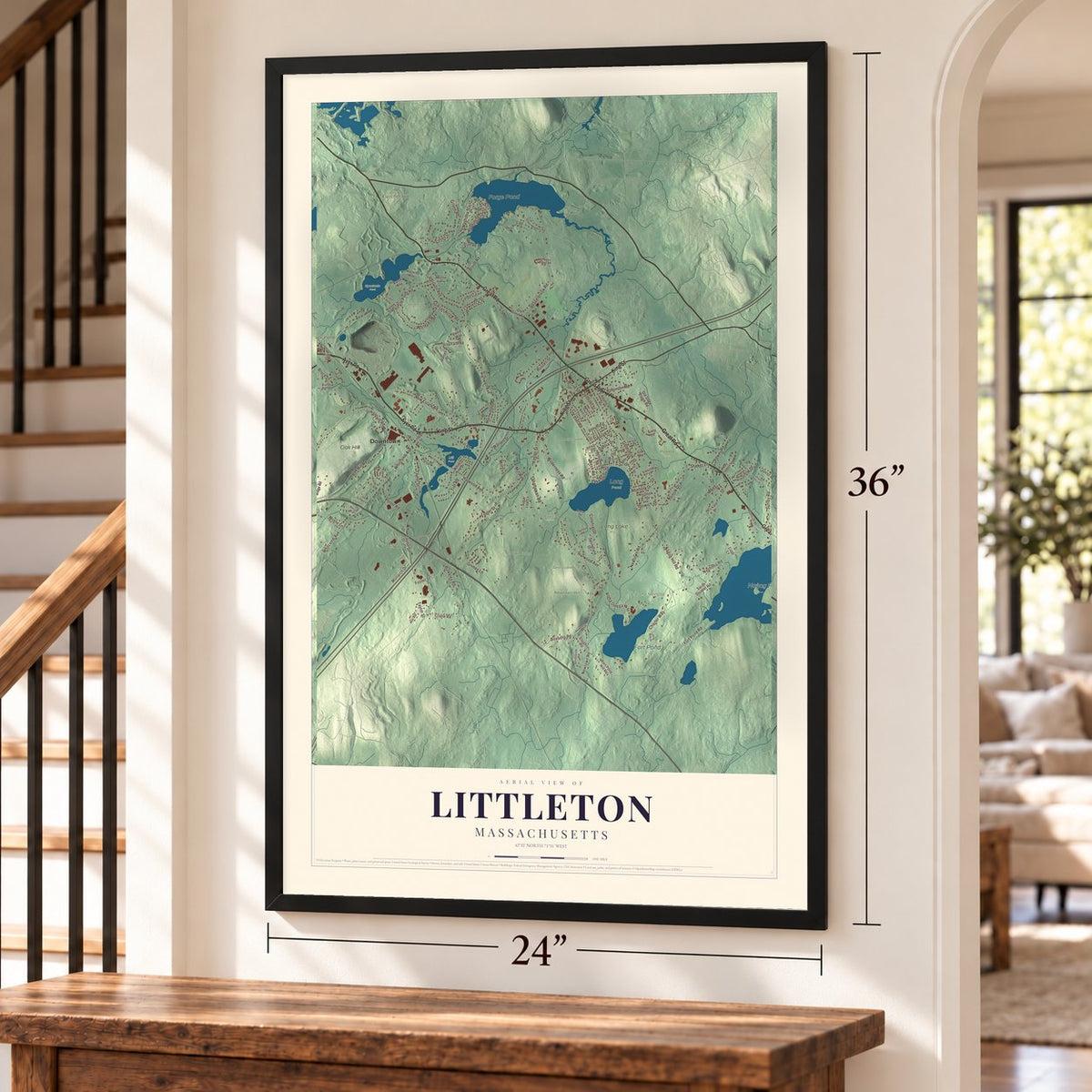 Littleton, Massachusetts map, 24 x 36 inch print in a black frame by a staircase