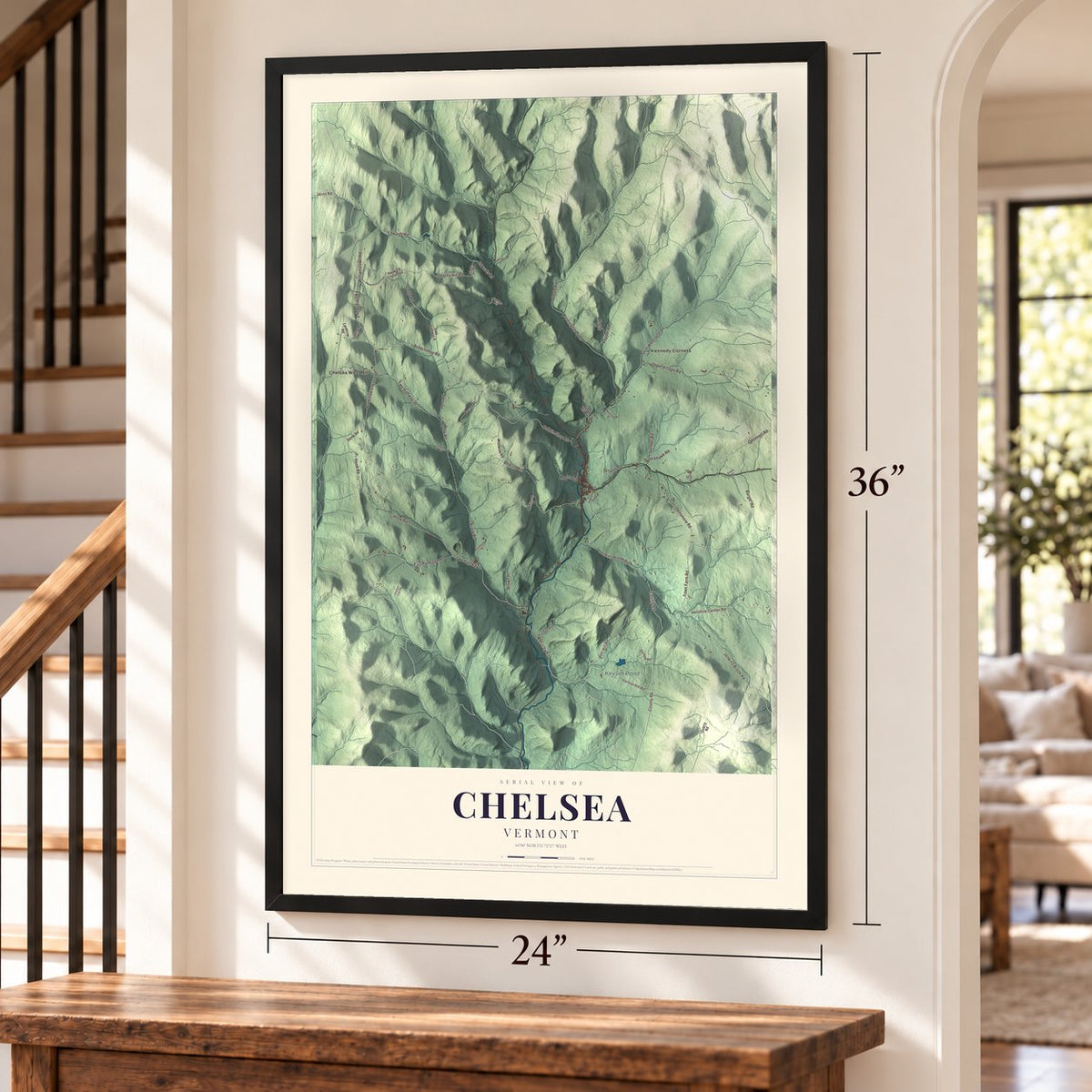 Chelsea, Vermont map, 24 x 36 inch print in a black frame by a staircase
